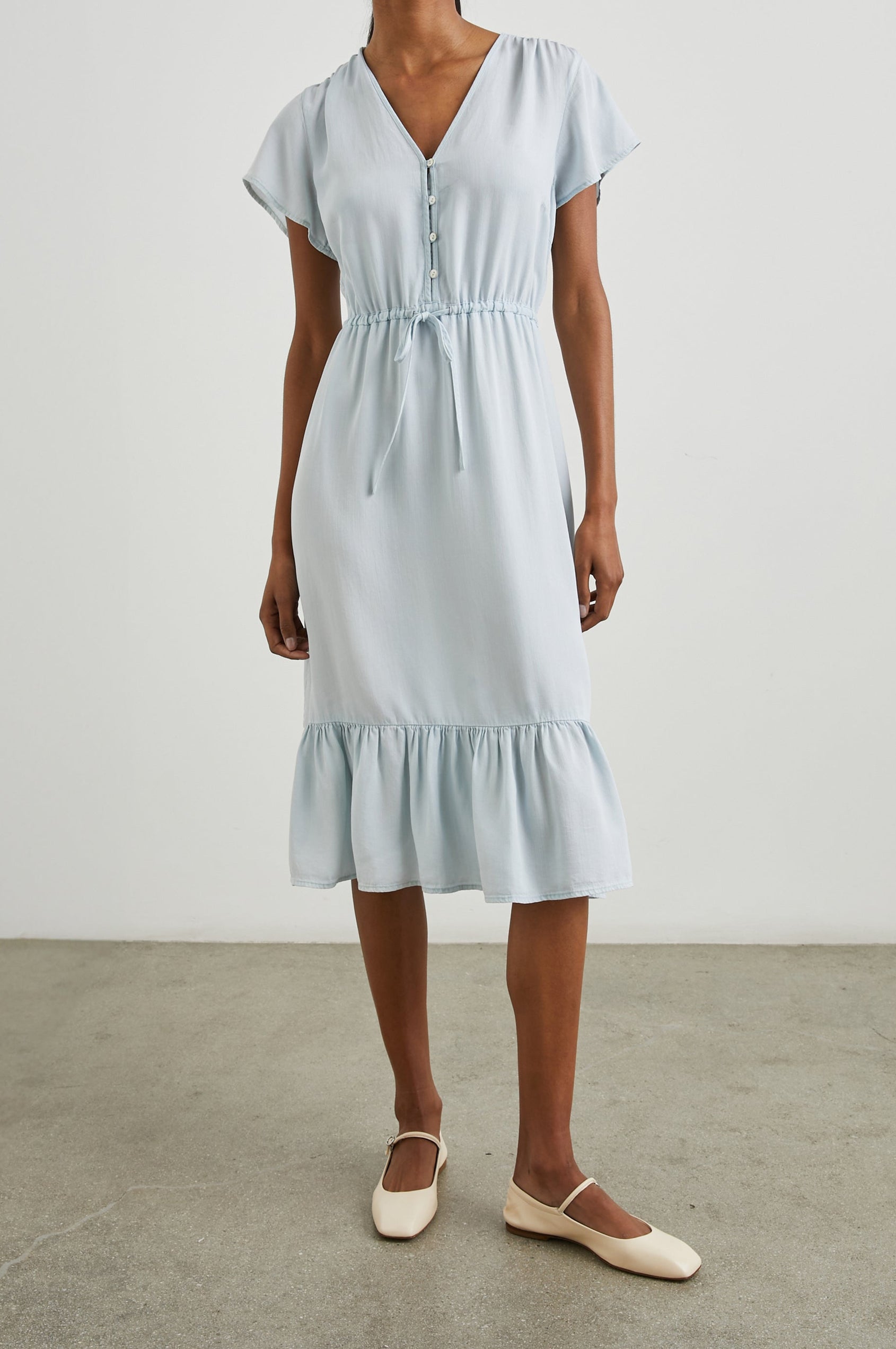 Kiki Short Sleeve Midi Dress with a V Neck, Buttons Down the Front Bodice, a Drawstring Waist and Ruffles at the Hem in Light Vintage Colorway - Front Full Body View Featured on Model