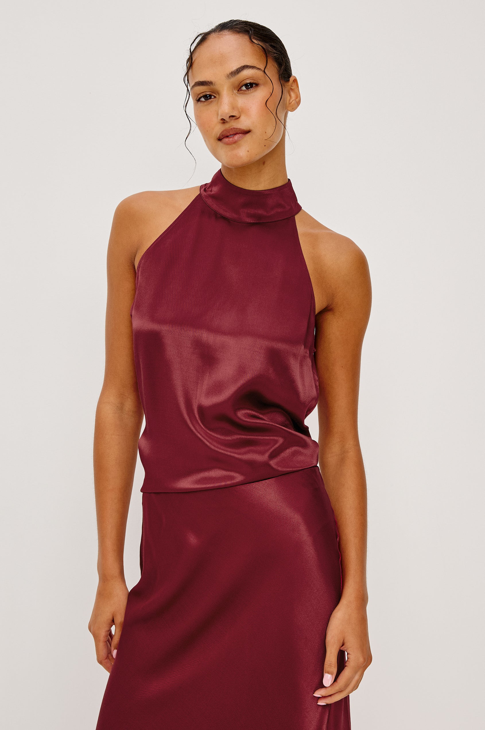 Leah Top with High Neck Halter Top with Back Button Closure in Black Crinkle Colorway - Front Tucked View Featured on Model