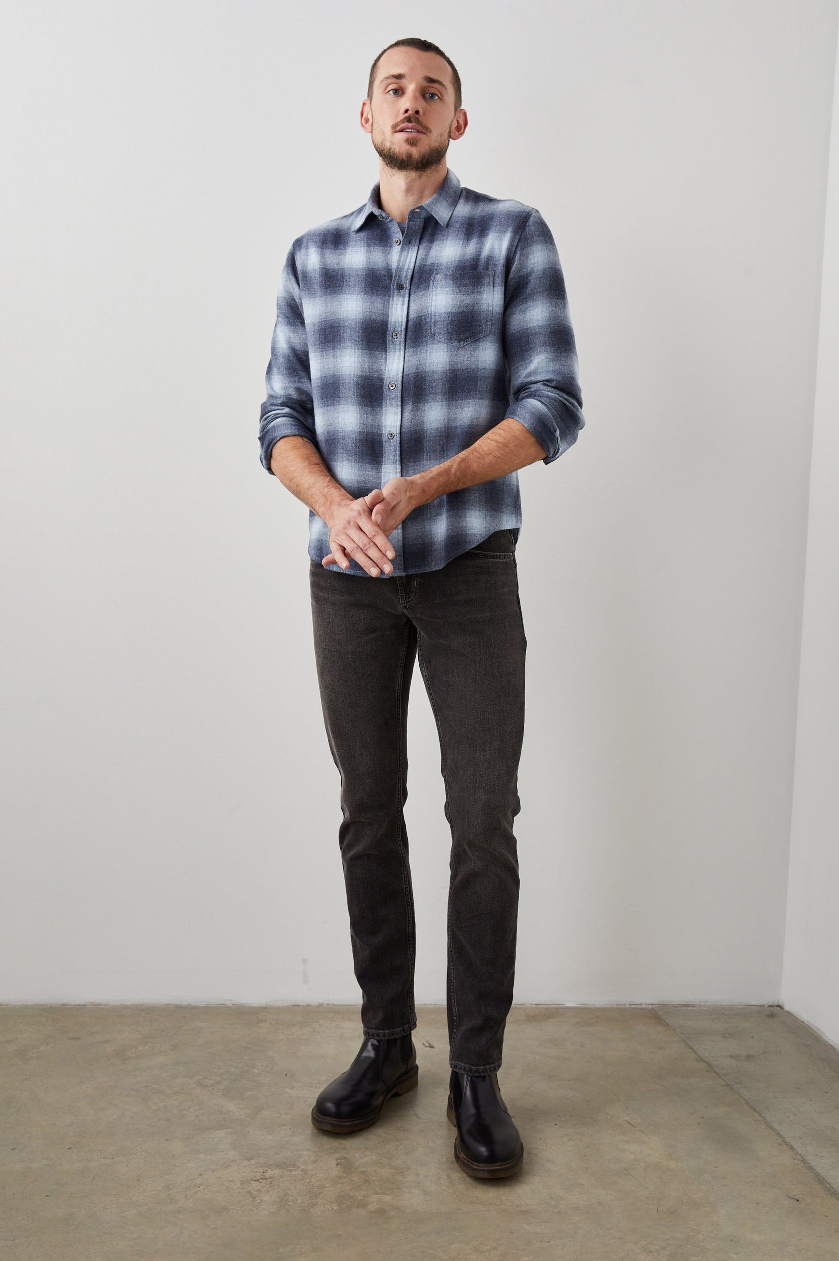 Lennox Long-Sleeve Button Up with a Chest Patch Pocket in Denim Shadow Colorway, a plaid in Denim, Grey and White- Front Full Body View Featured on Model