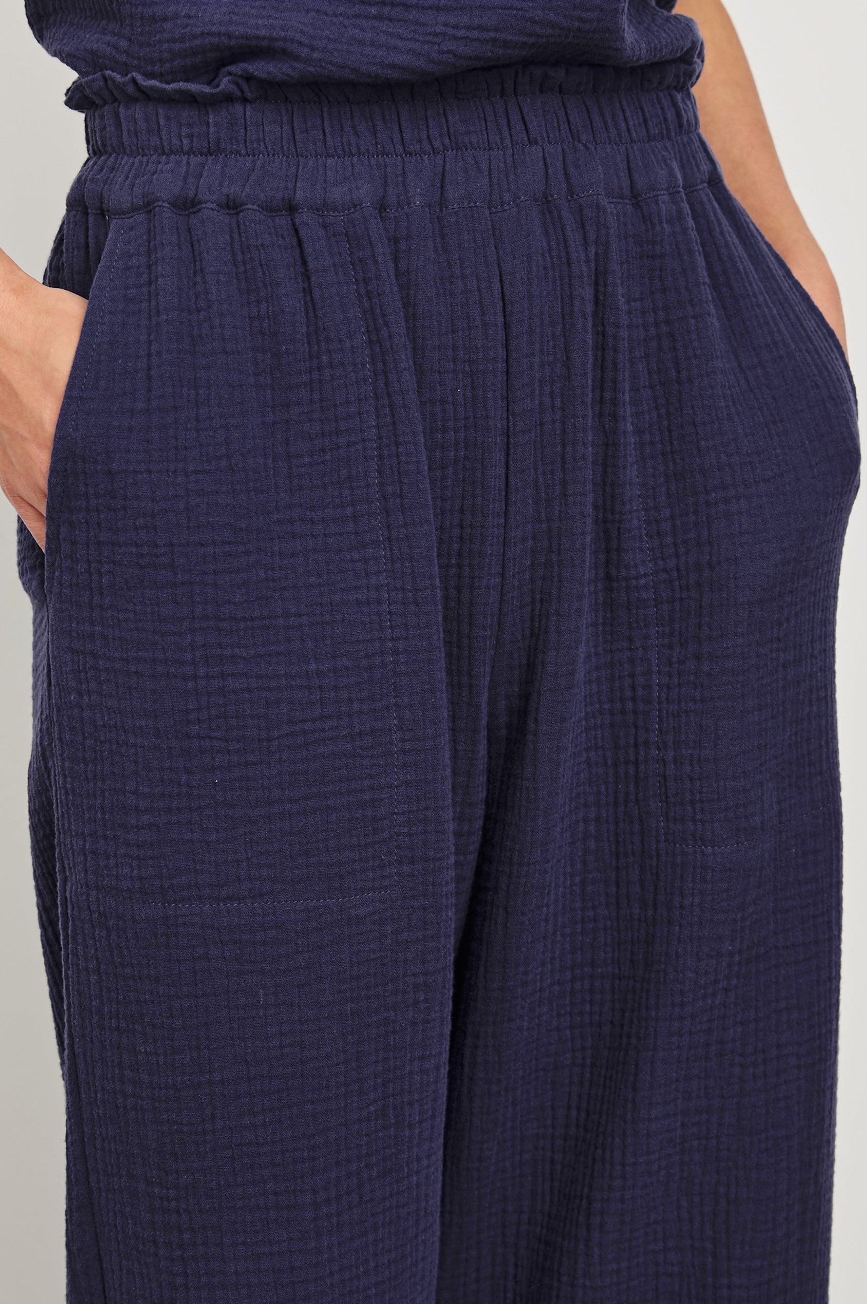 Leon Crop Cotton Gauze Pant With Hemline Slit And Elastic Waist In Colorway Admiral Blue - Detail View Featured On Model
