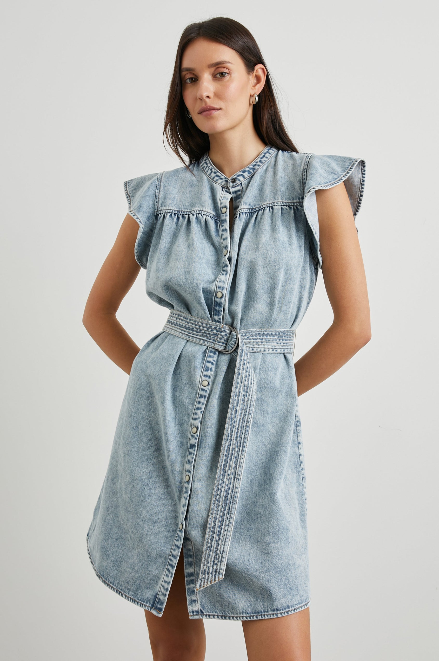 Letta Above-Knee Dress with Flutter Sleeves, Snaps down the Front, and a Belted Waist in Faded Indigo Colorway - Front View Featured on Model