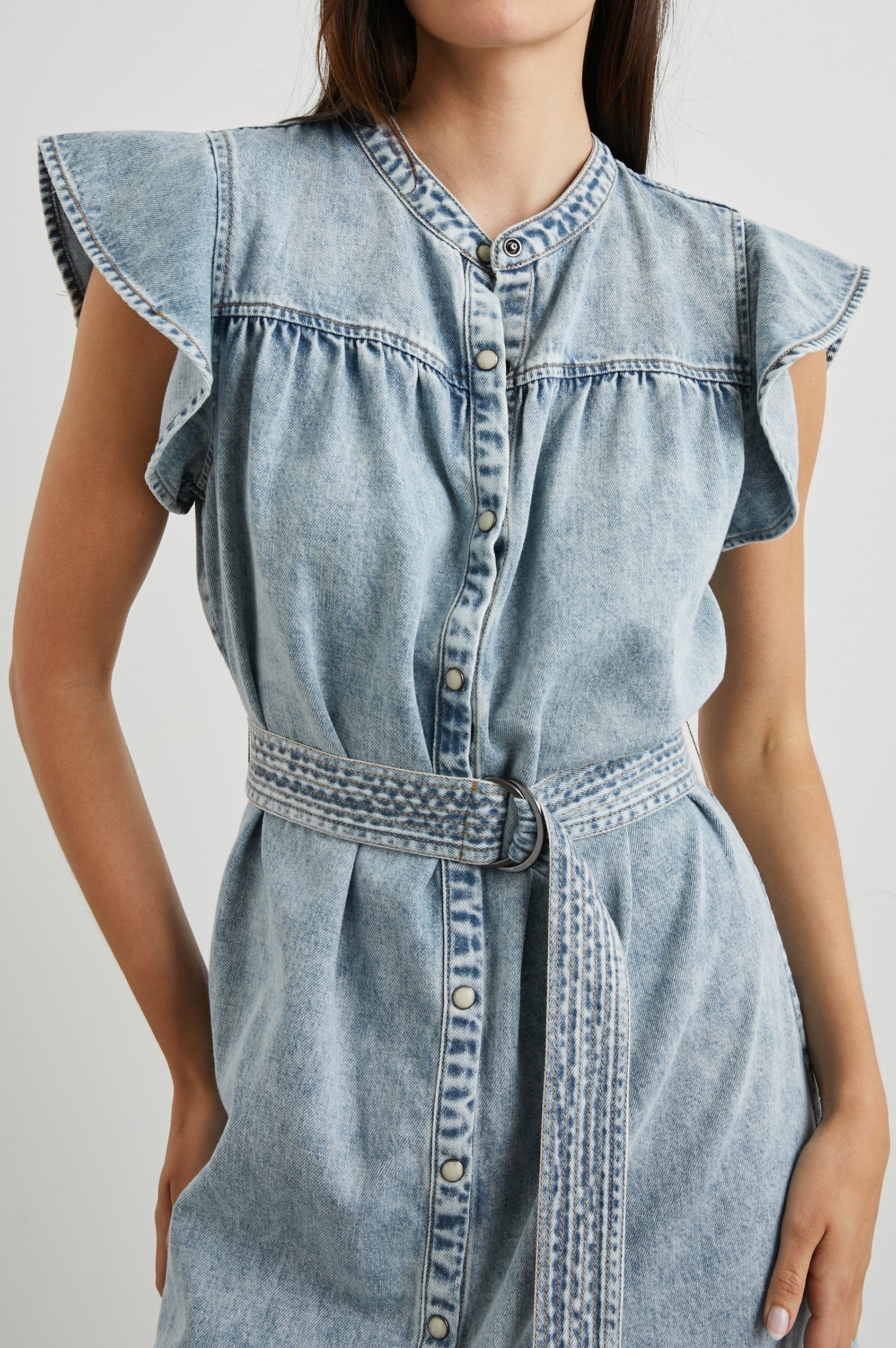 Letta Above-Knee Dress with Flutter Sleeves, Snaps down the Front, and a Belted Waist in Faded Indigo Colorway - Front View Featured on Model