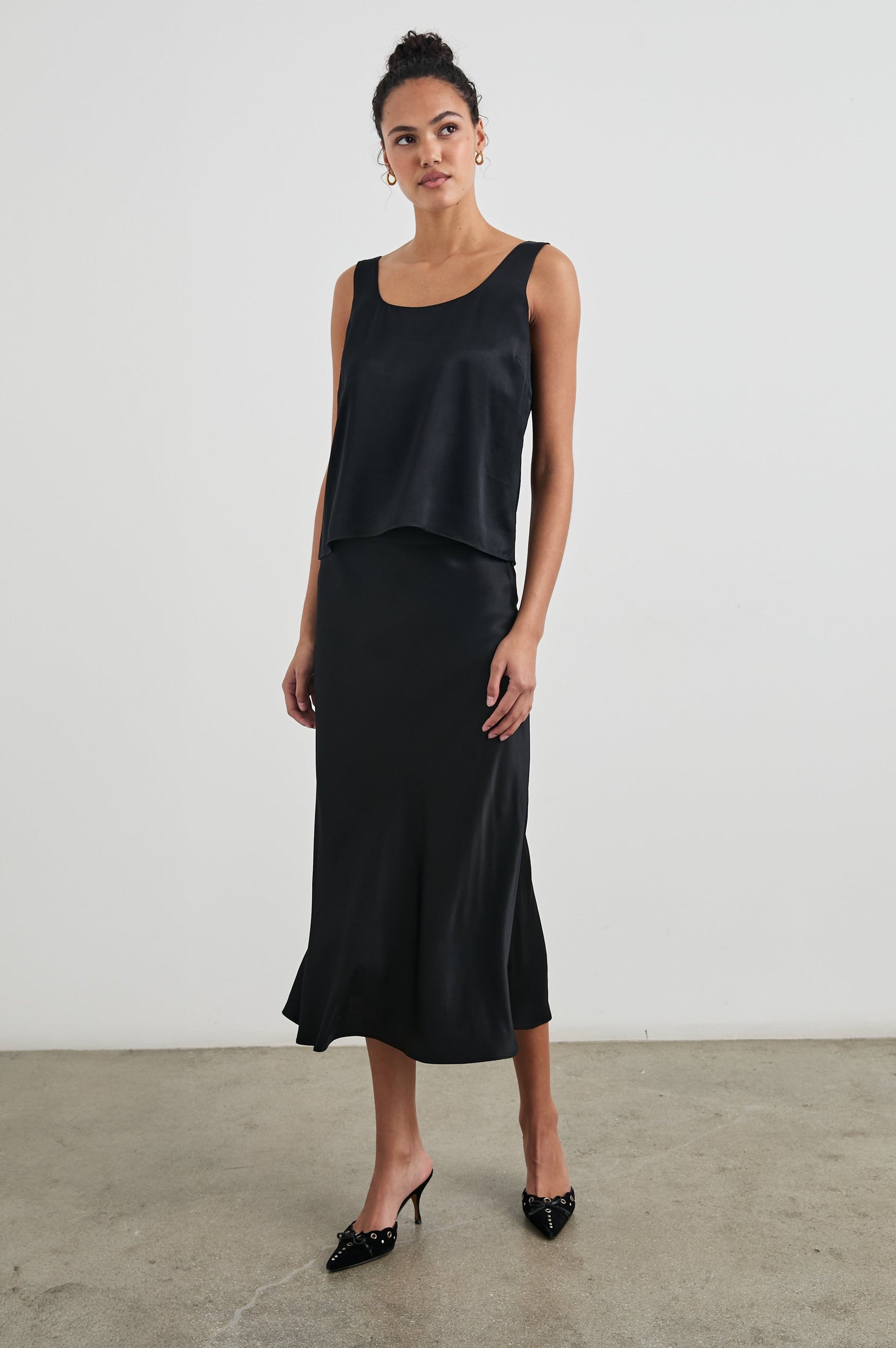Lexi Tank Top with a Scoop Neck in Black Colorway - Front Full Body View Featured on Model