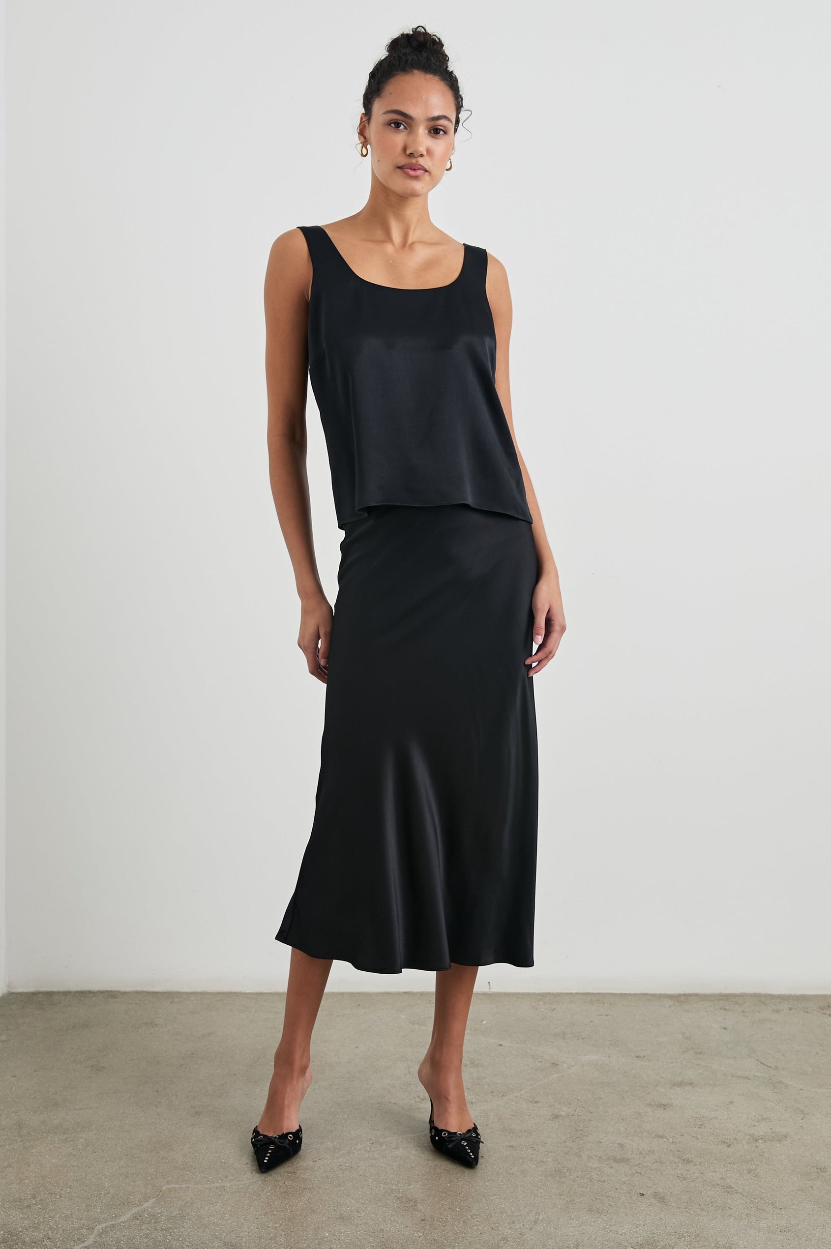 Lexi Tank Top with a Scoop Neck in Black Colorway - Front Full Body View Featured on Model