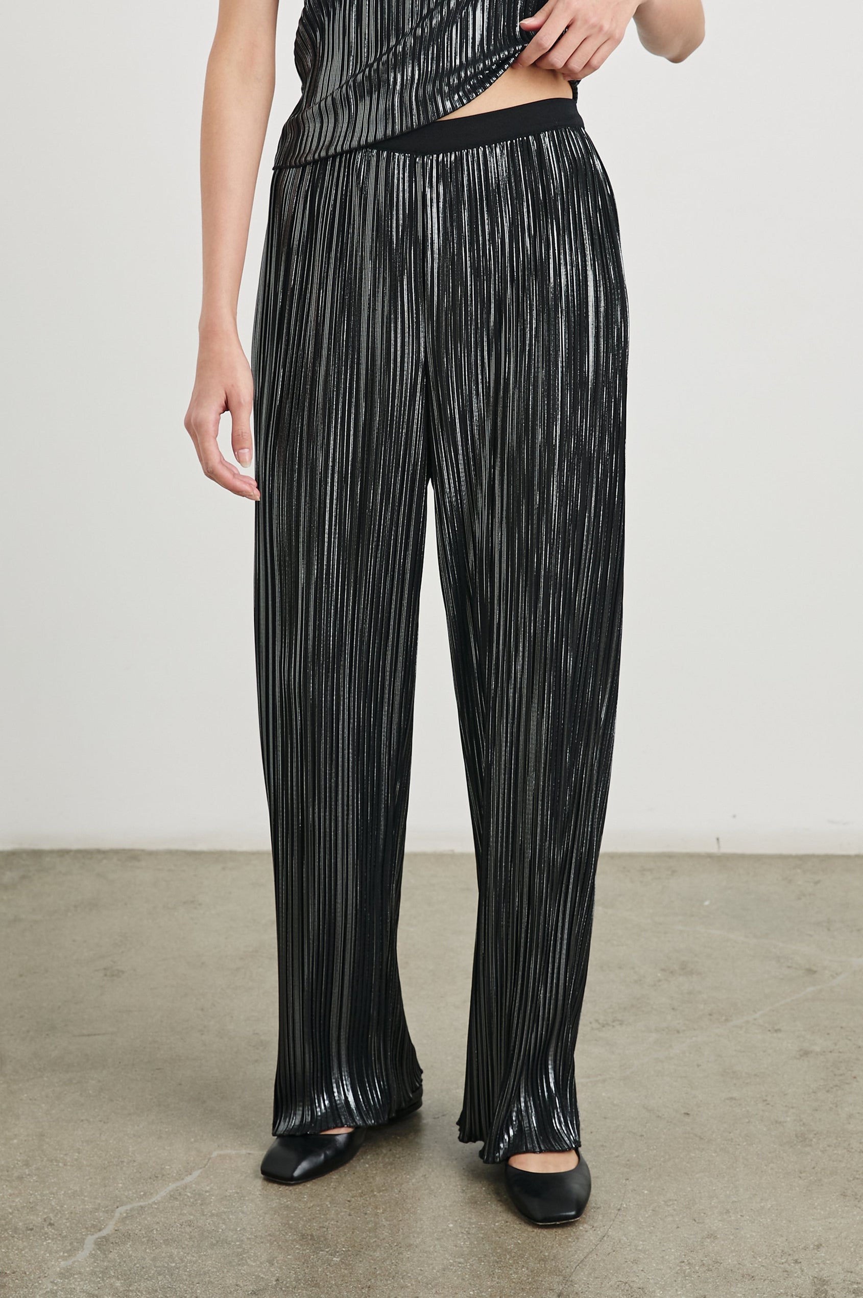 Liana Micro-Pleated Pants with an Elastic Waist in Gunmetal Colorway, Thin black, white and grey Vertical Stripes - Front View Featured on Model