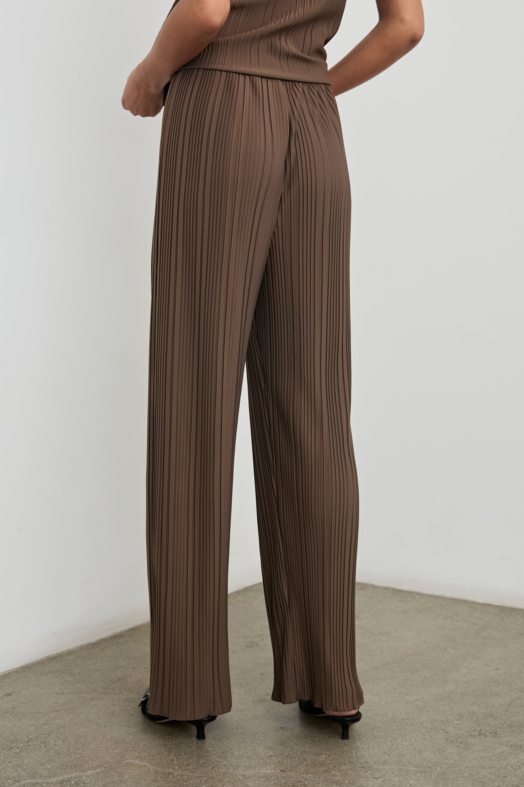 Liana Micro-Pleated Pants with an Elastic Waist in Morel Colorway - Back View Featured on Model