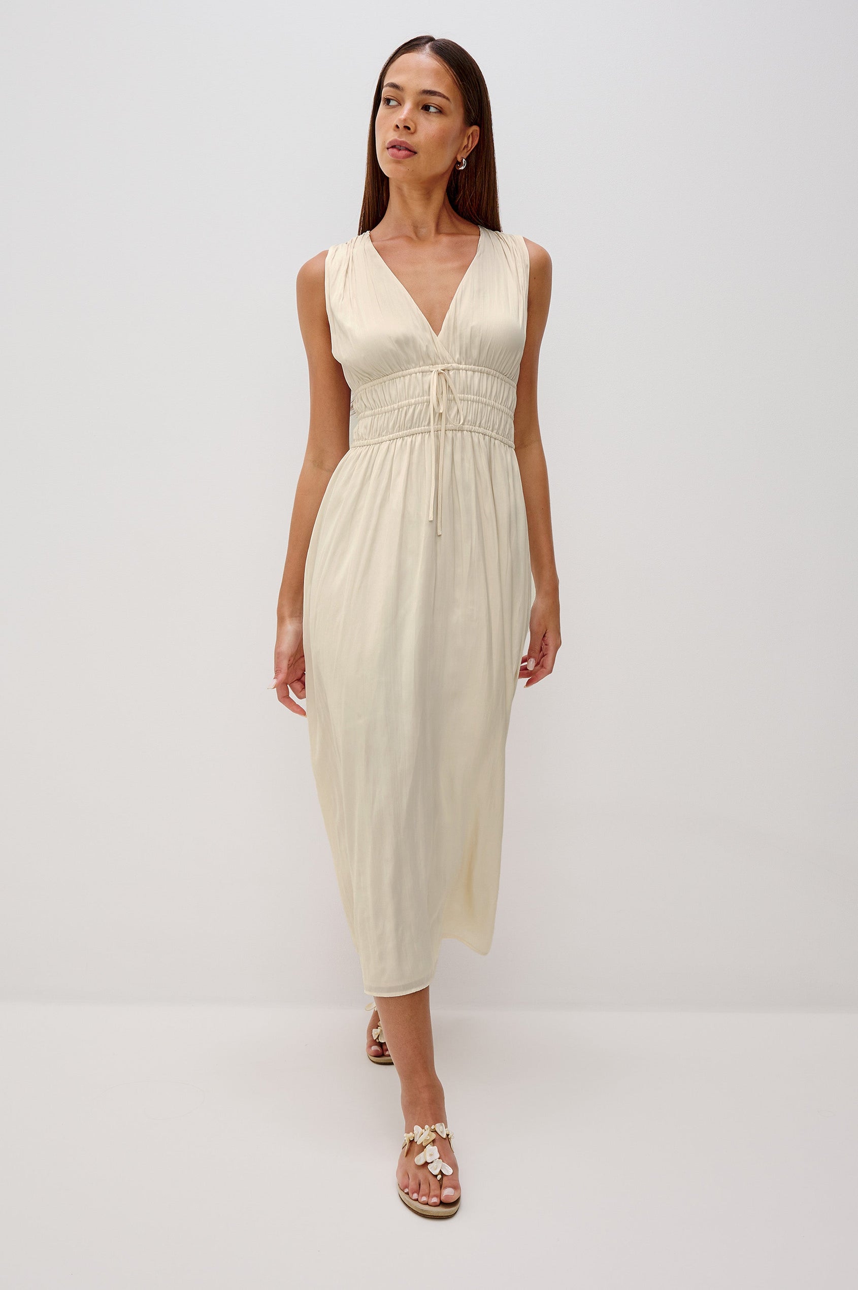 Lilith V-Neck Midi Dress with Drawstring at Under Bust and Gathering Detail at Shoulder Seam and Waist in Ivory Colorway. Full Body Front View Shown on Model.