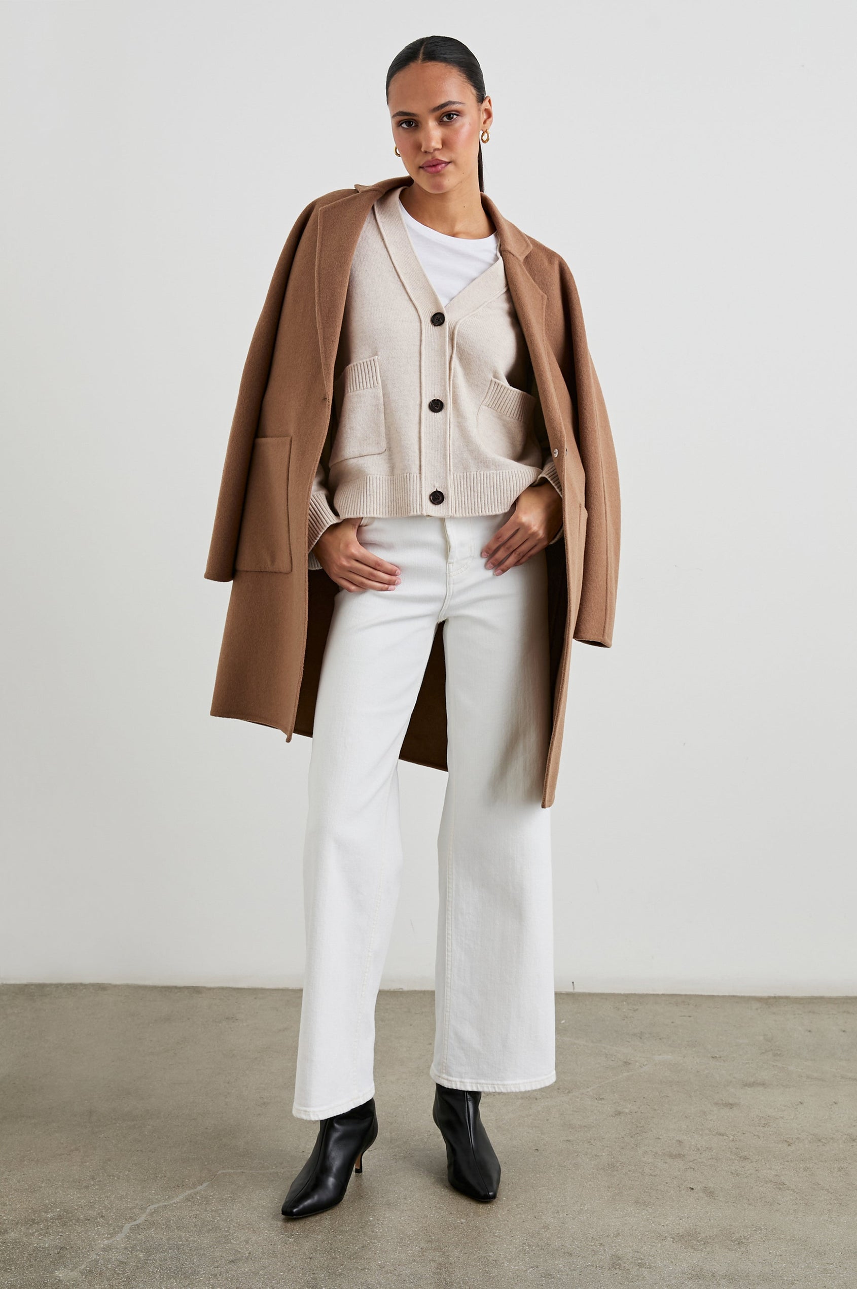Lindi Long-Sleeve V Neck Cardigan with Three Button Closure, Two Front Patch Pockets and Ribbed Trim in Oatmeal Colorway - Front Full Body View Featured on Model