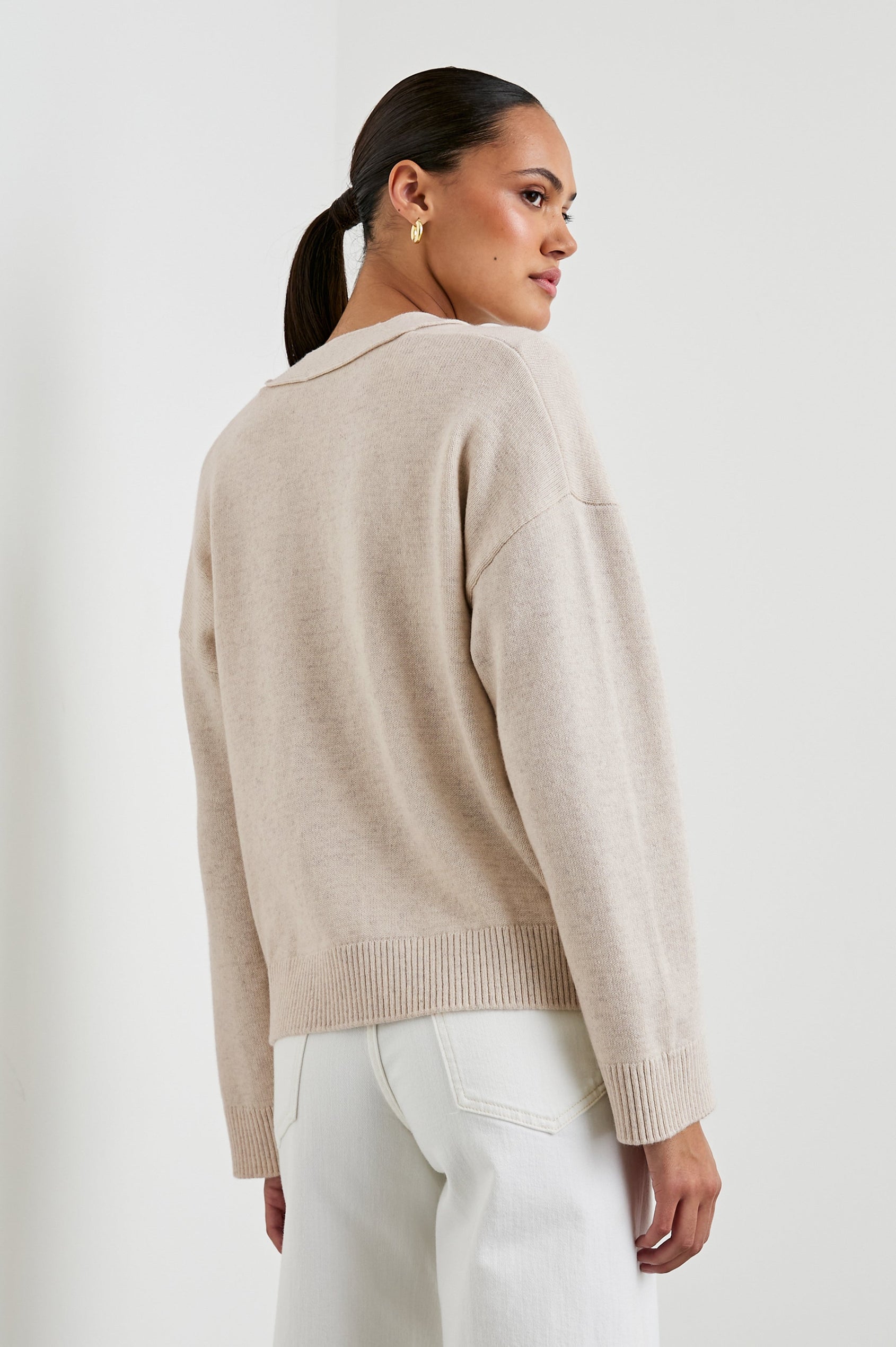 Lindi Long-Sleeve V Neck Cardigan with Three Button Closure, Two Front Patch Pockets and Ribbed Trim in Oatmeal Colorway - Back View Featured on Model