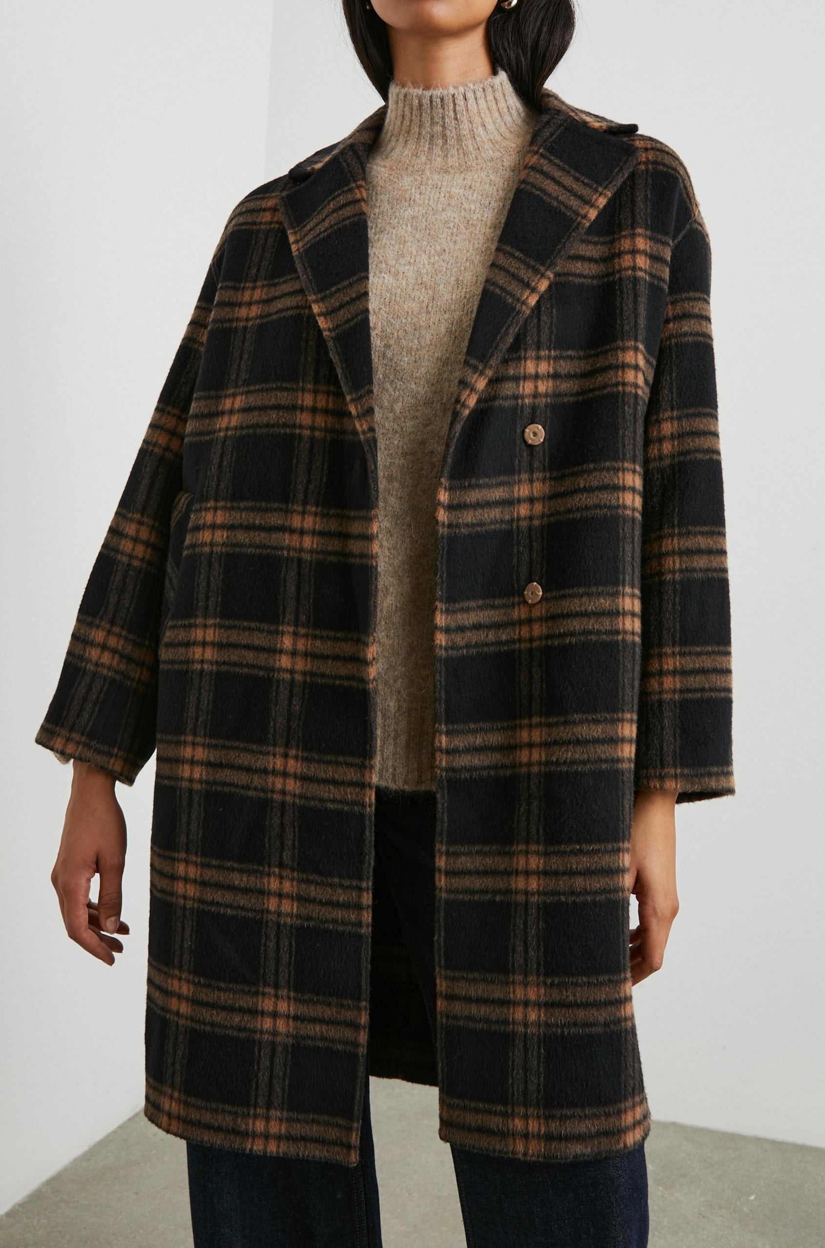 Lore Knee-Length Coat with Two Button Closure, Notched Lapels and Two Front Pockets in Camel Jet Colorway, a Plaid - Front View Featured on Model