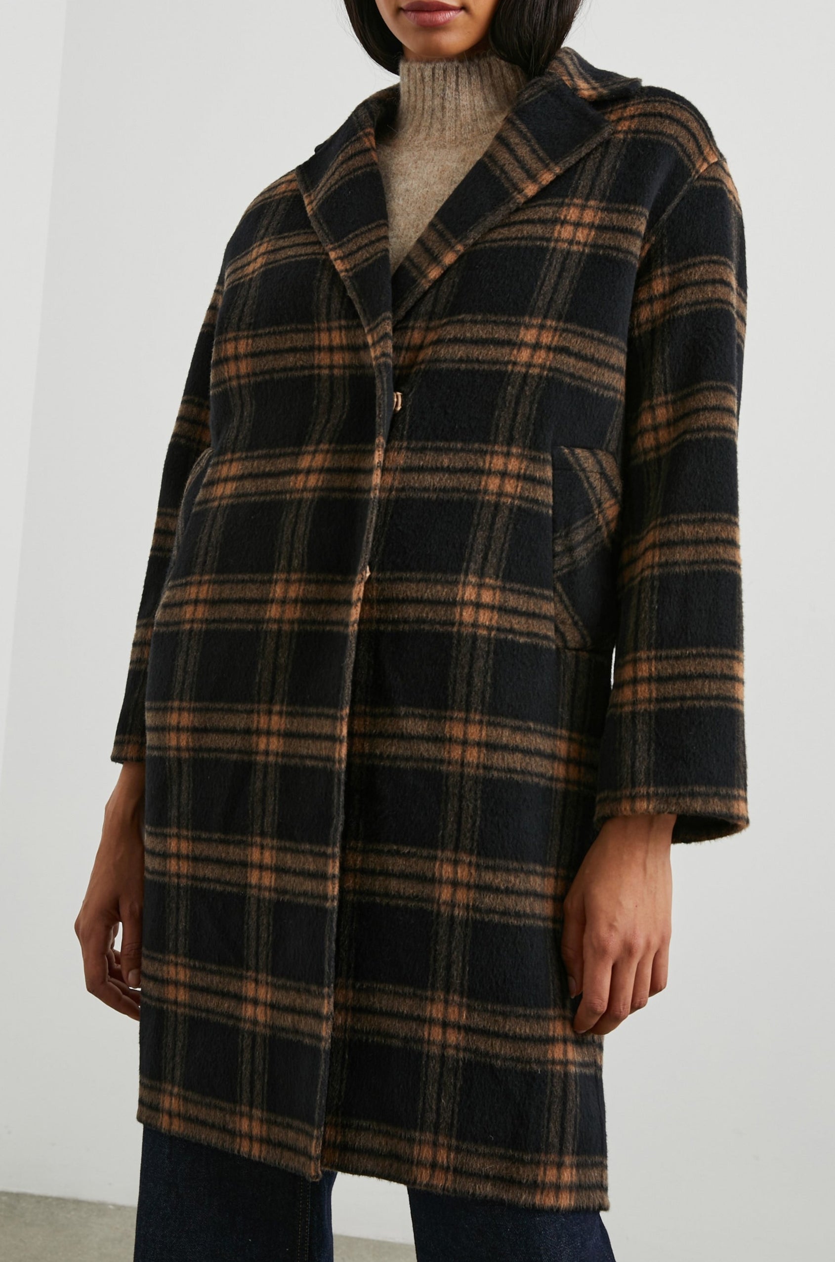 Lore Knee-Length Coat with Two Button Closure, Notched Lapels and Two Front Pockets in Camel Jet Colorway, a Plaid - Front View Featured on Model
