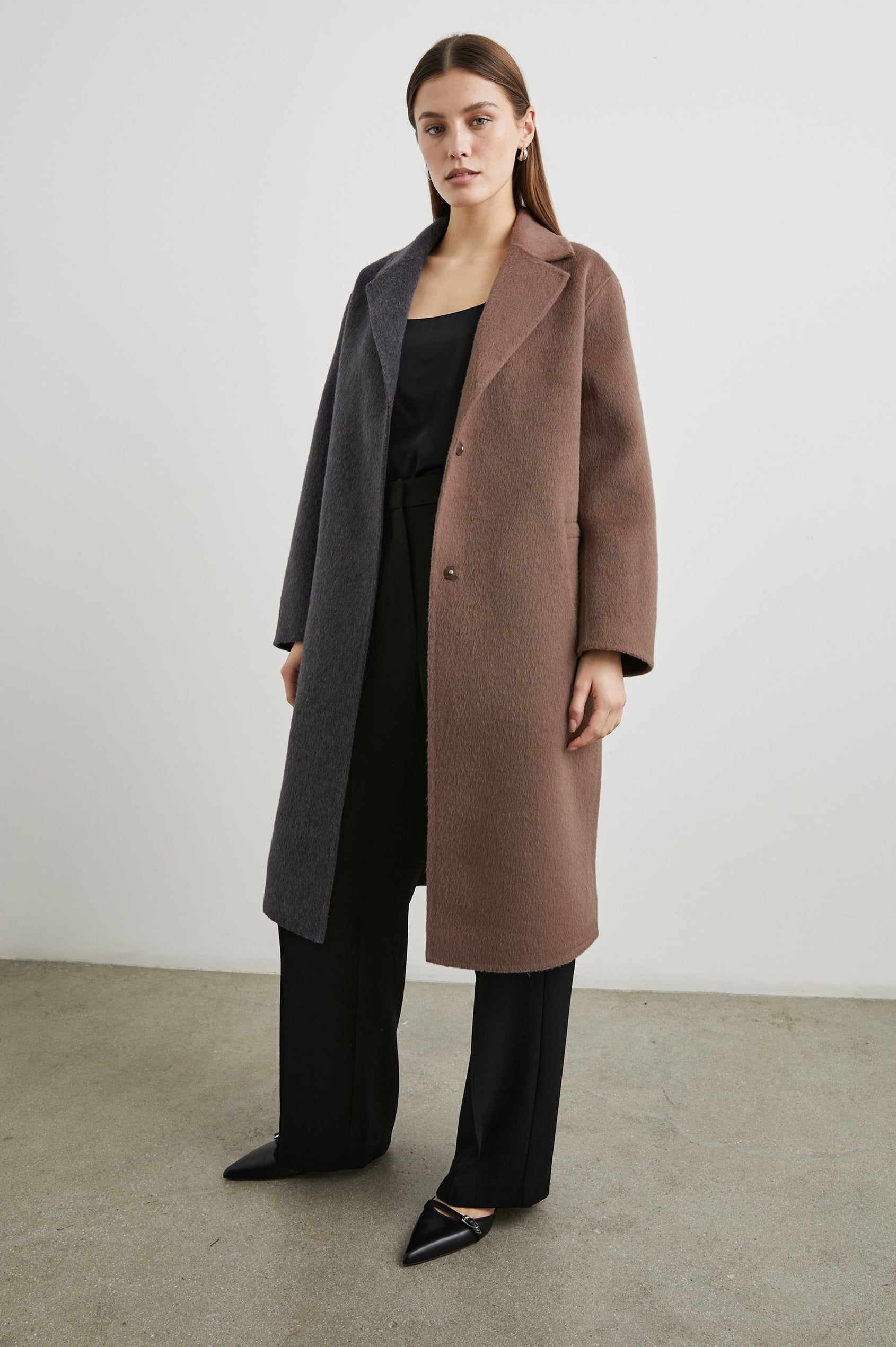 Lore Knee-Length Coat with Two Button Closure, Notched Lapels and Two Front Pockets in Charcoal Mink Mix Colorway, Left Half of Jacket is Mink and the Right Half is Charcoal - Front Full Body View Featured on Model