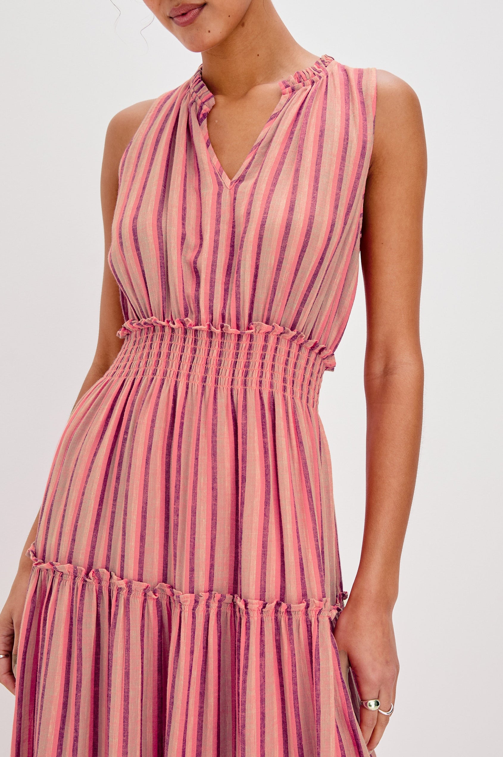 Loulou V-Neck Midi Dress with Smocked Elastic Waistband and a Multi Tiered Skirt in Cabana Stripe Colorway. Front View Shown on Model.