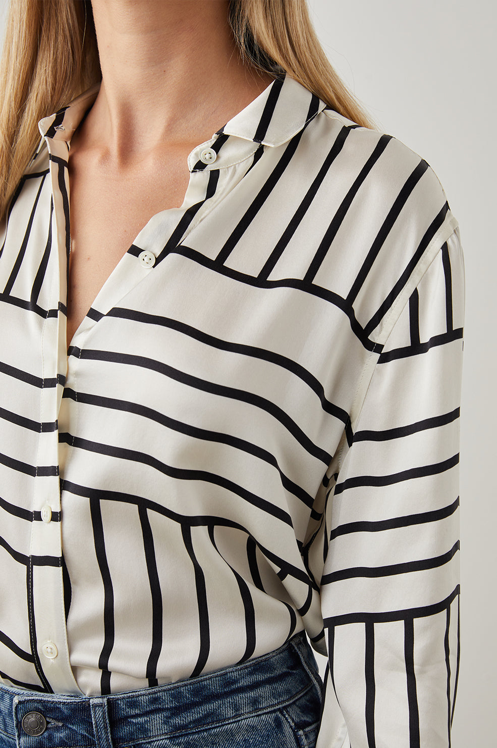 Mara Long-Sleeve Button Up with One Center Pleat Under the Back Yoke in Patchwork Stripe Colorway, Patches of Horizontal and Vertical Black Stripes on Cream - Front View Featured on Model
