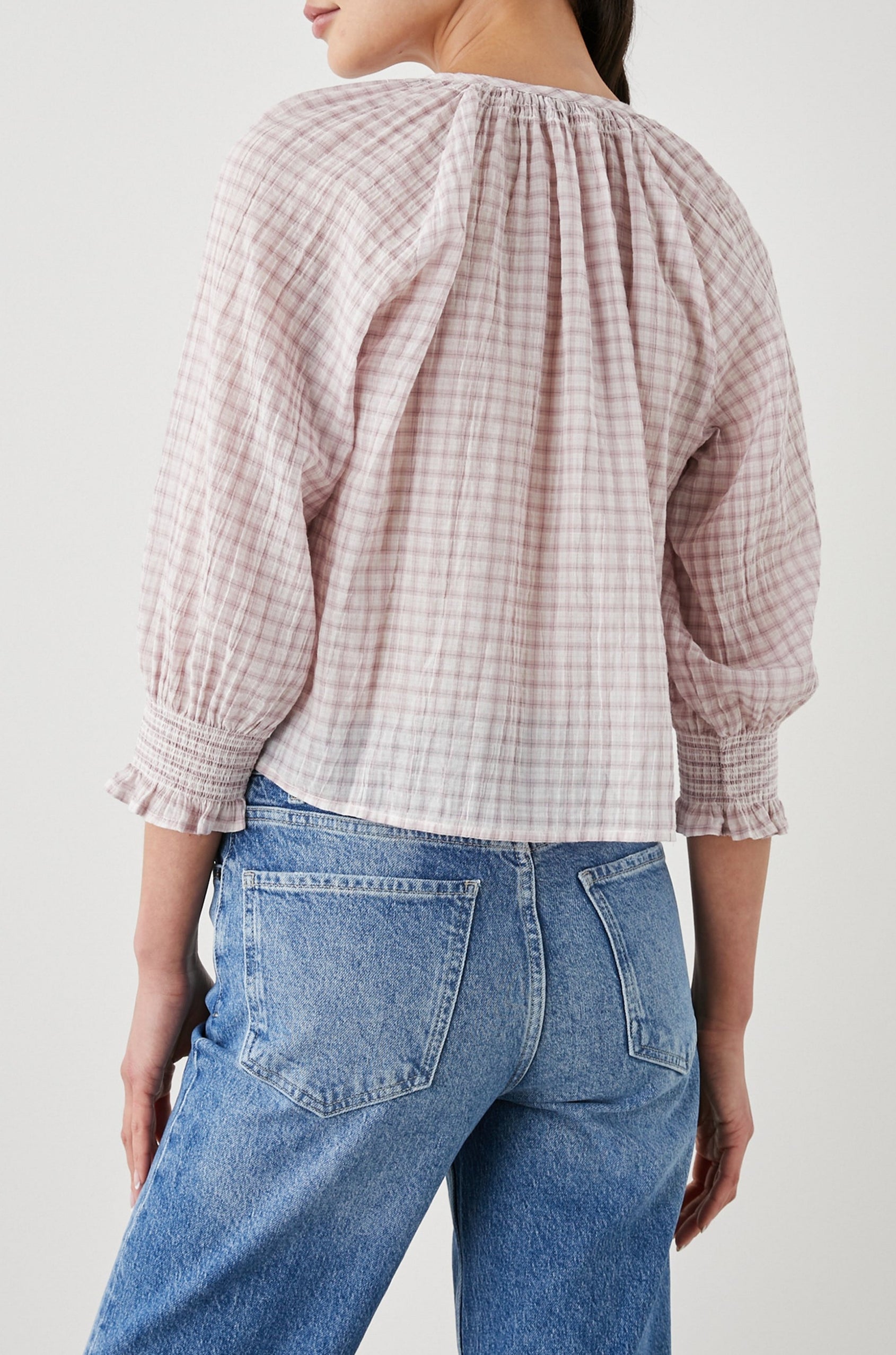 Mariah Top with Three-Quarter Sleeves, Shirred Cuffs, V-Neckline, and Buttons Down the Front in Soft Rose Check Colorway, a White and Rose Plaid - Back View Featured on Model