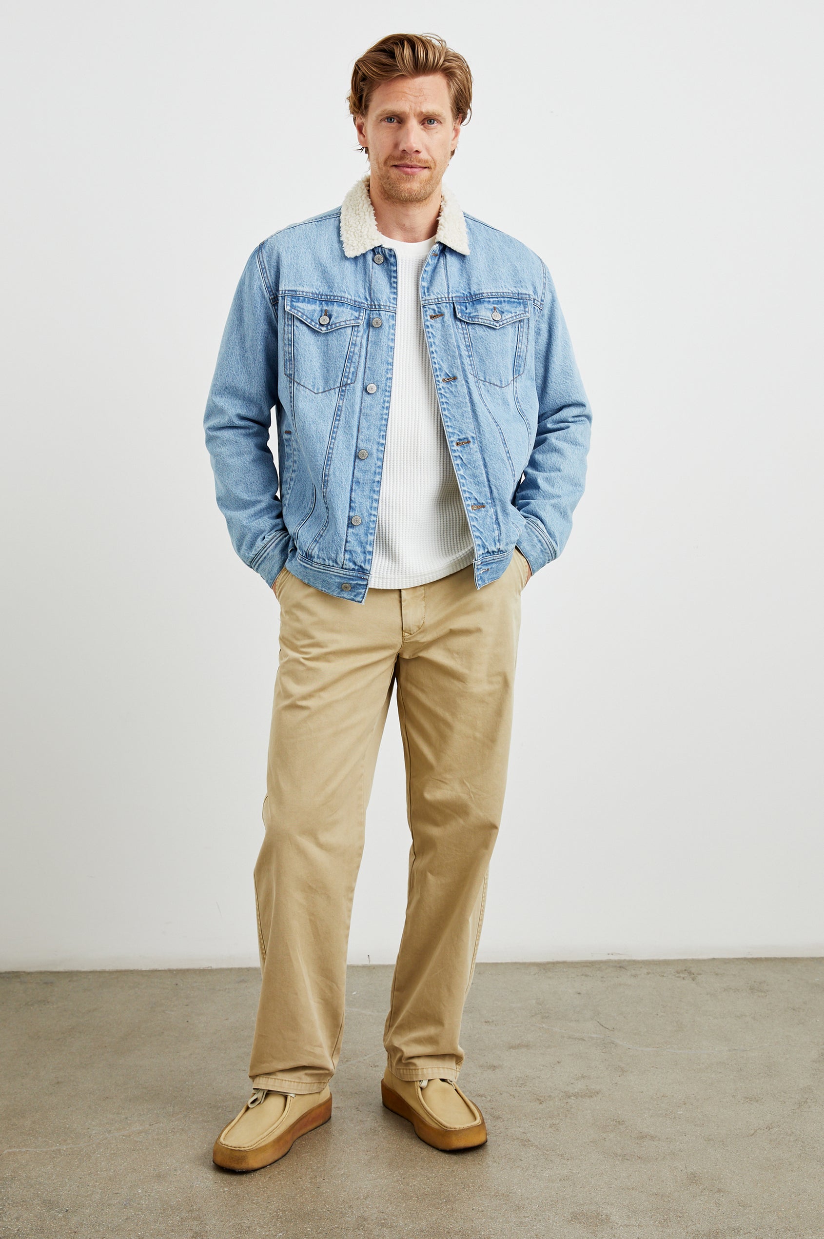 McKinley Denim Jacket with Button Closure, Two Chest Button Flap Pockets and a Cream Faux Sherpa Collar in Vintage Wash Colorway - Front Full Body View Featured on Model