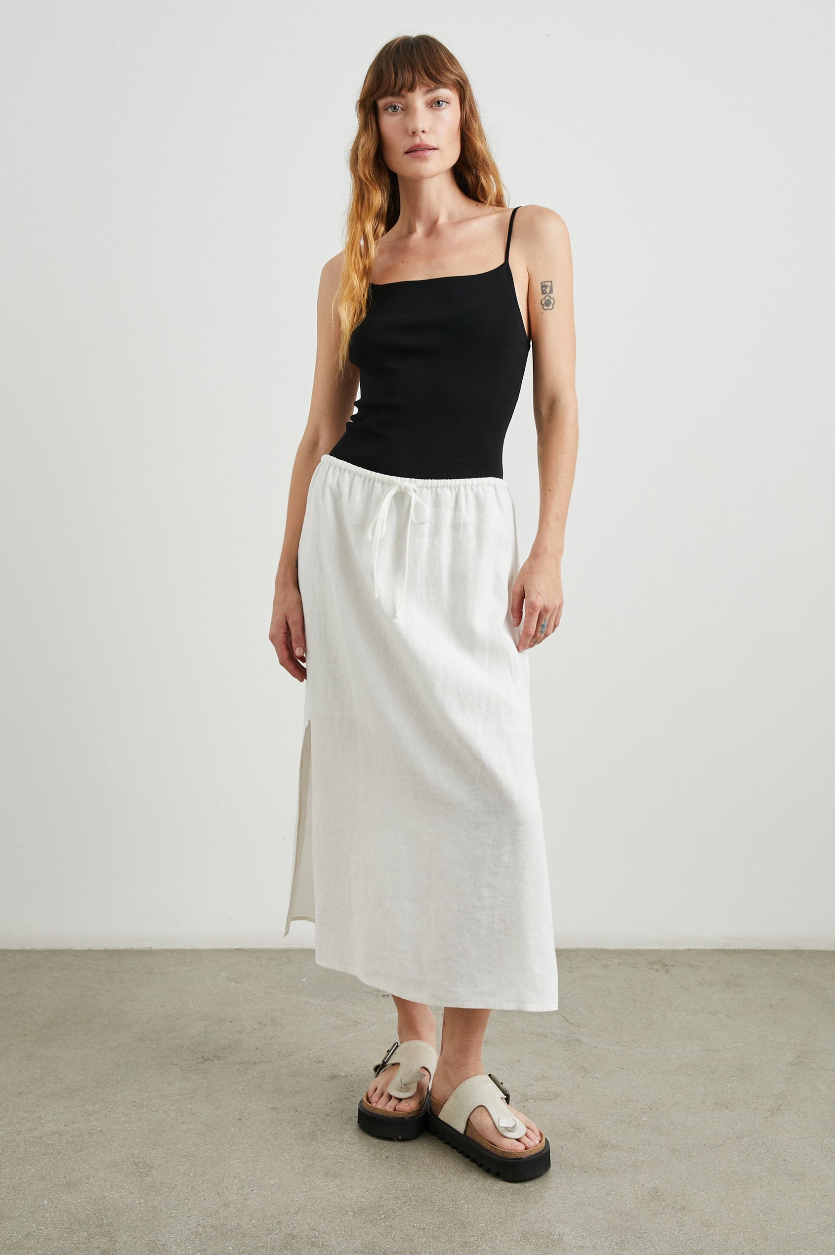 Monet Midi Skirt with Two Side Slits and a Drawstring Waist in White Colorway - Front Full Body View Featured on Model