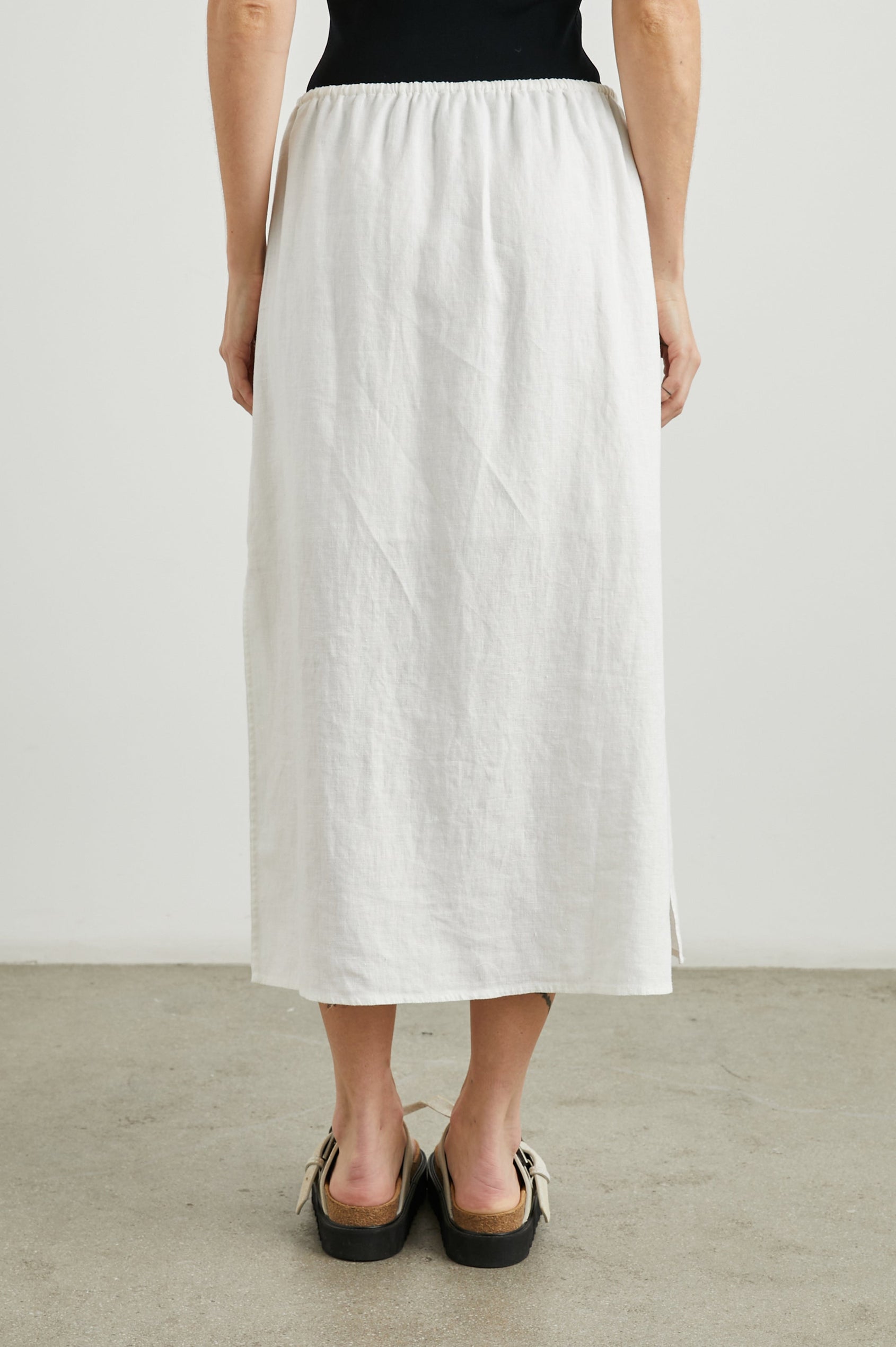 Monet Midi Skirt with Two Side Slits and a Drawstring Waist in White Colorway - Back View Featured on Model