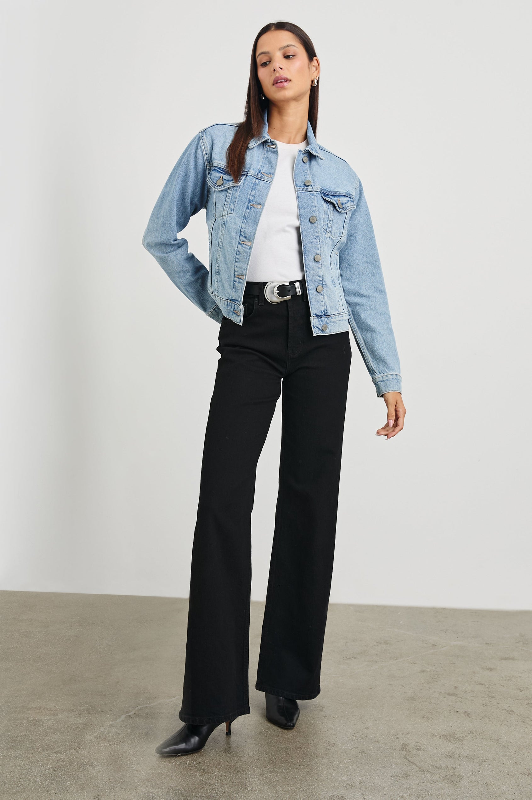 Mulholland Denim Jacket with Button Closure, Two Chest Button Flap Pockets, Two Front Pockets, Adjustable Button Straps on Hem in Original Blue Colorway - Front Full Body View Featured on Model
