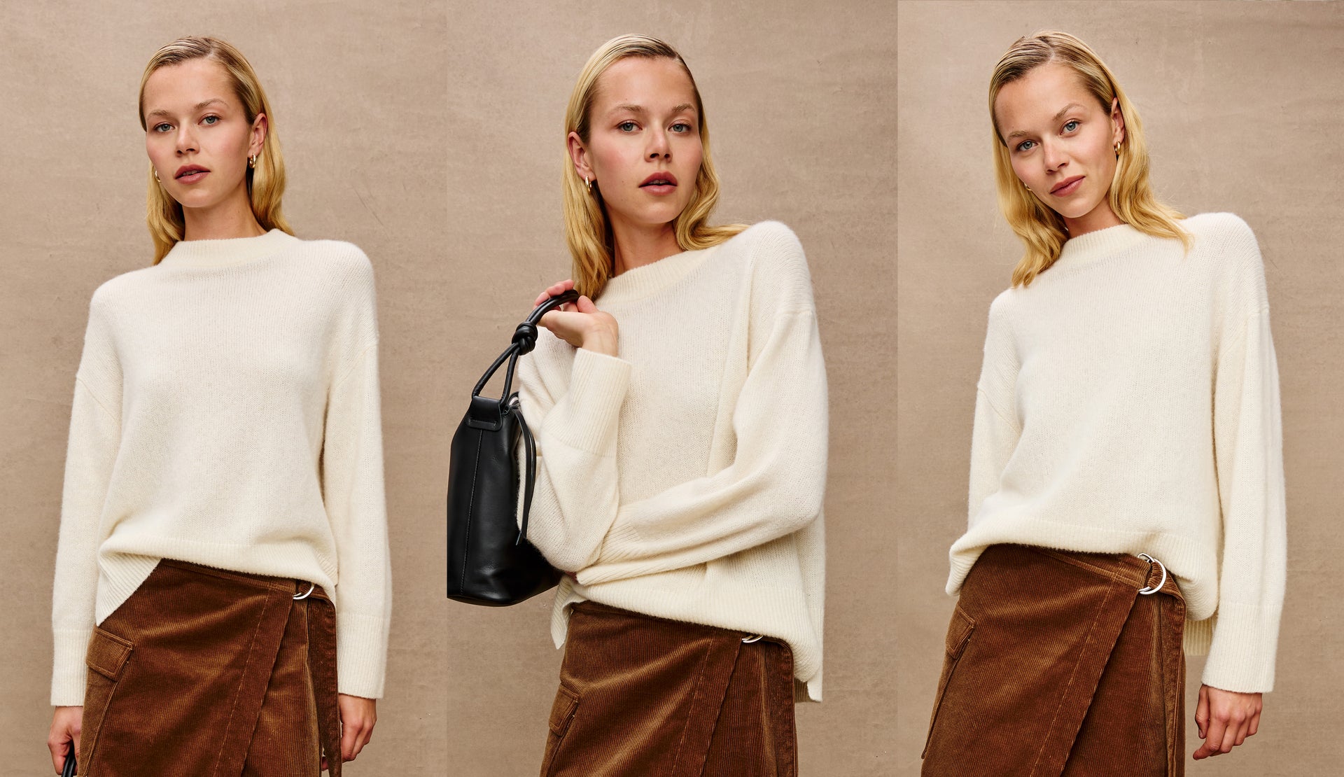 Woman wearing a white sweater and brown pants with a black handbag against a beige background