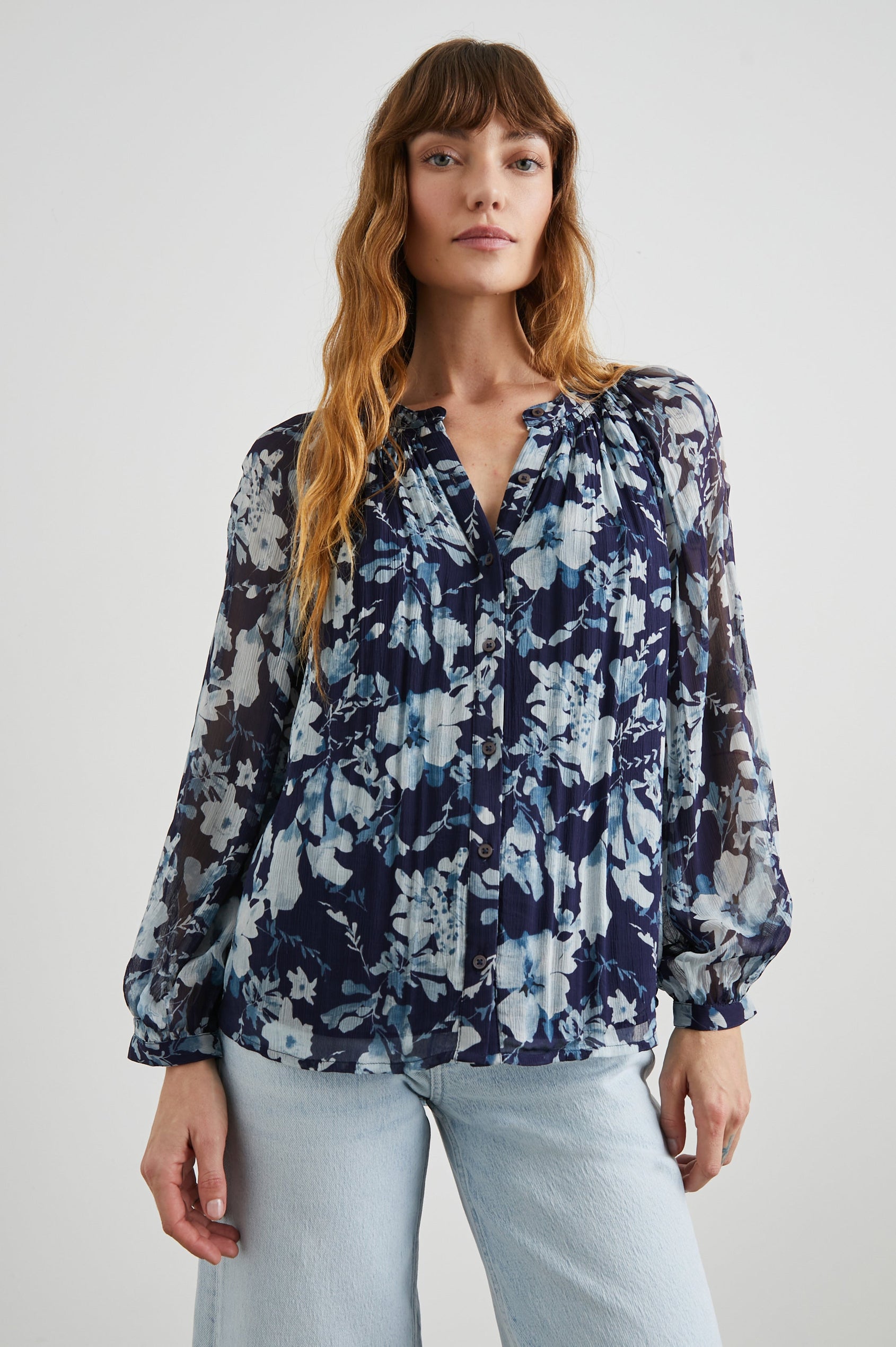 Nessie Long Sleeve Top with Front Button Closure and Ruching along the Neckline in Indigo Blossoms Colorway, Flowers in Blue on Indigo - Front View Featured on Model