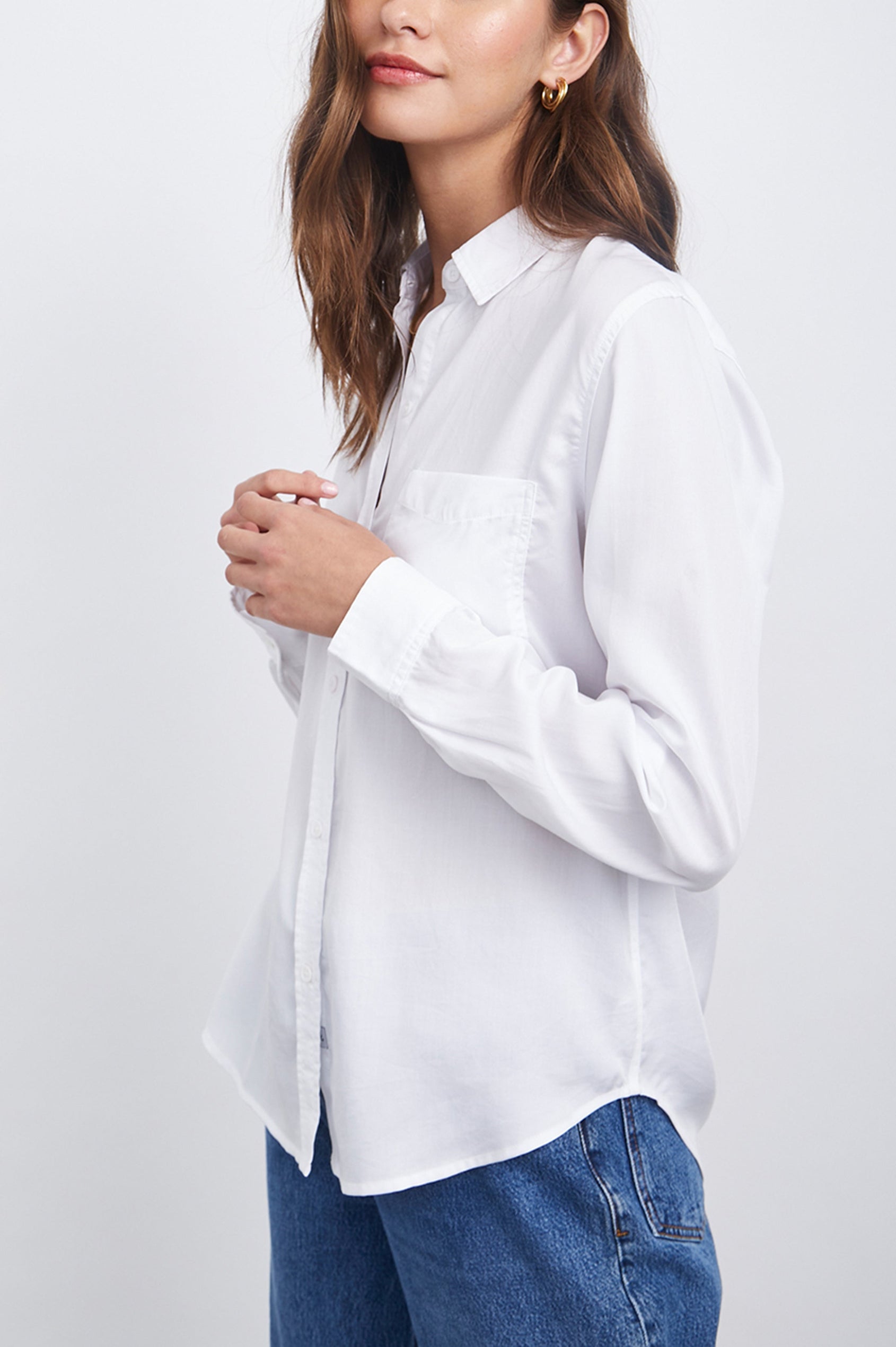 Paloma Long-Sleeve Button Up with a Chest Patch Pocket in White Colorway - Side View Featured on Model