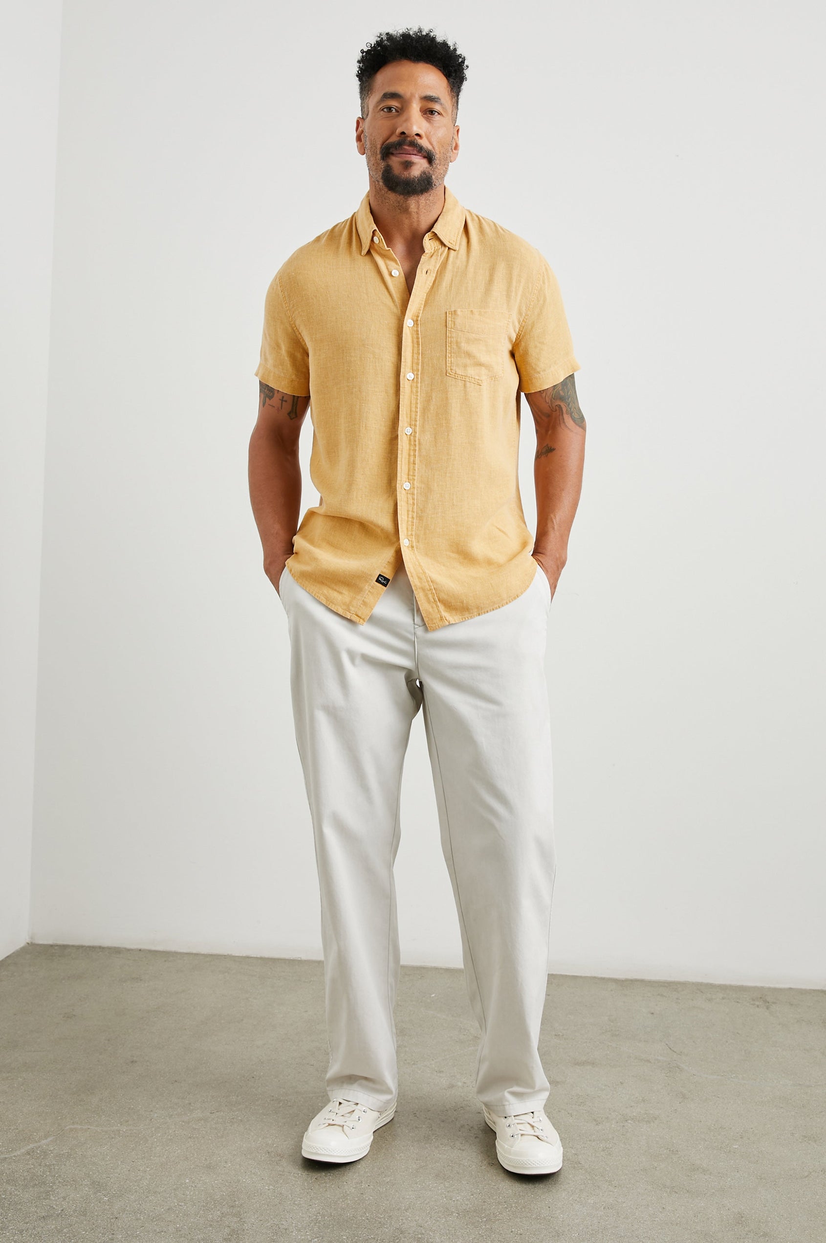 Paros Short-Sleeve Button Up with a Chest Patch Pocket in Uni Colorway, a Yellow - Front Full Body View Featured on Model