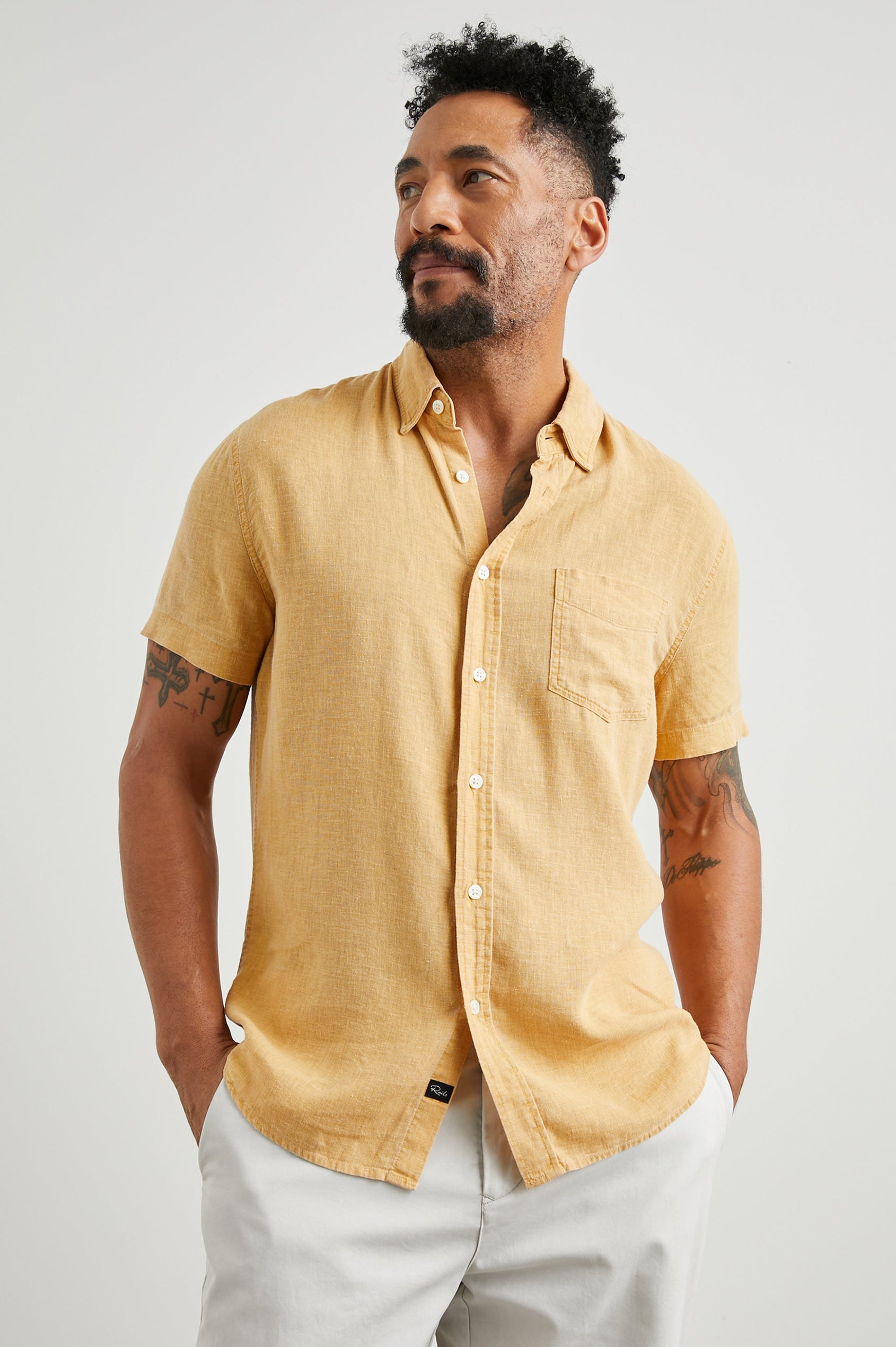 Paros Short-Sleeve Button Up with a Chest Patch Pocket in Uni Colorway, a Yellow - Front View Featured on Model