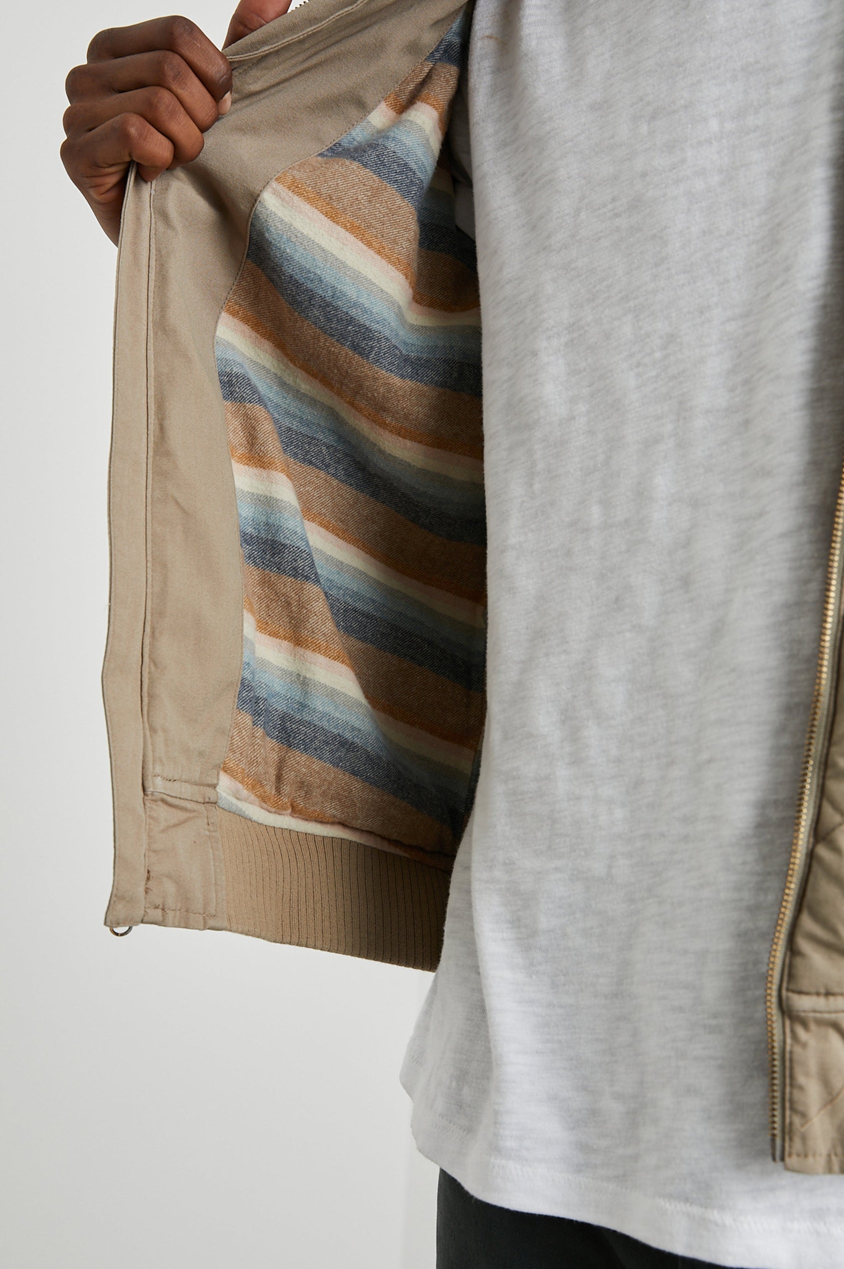 Peninsula Jacket with Zip Closure, Two Front Pockets, an Inner Zippered Pocket, a Quilted Pattern and Ribbed Trim in Vintage Khaki Colorway - Inside View Featured on Model