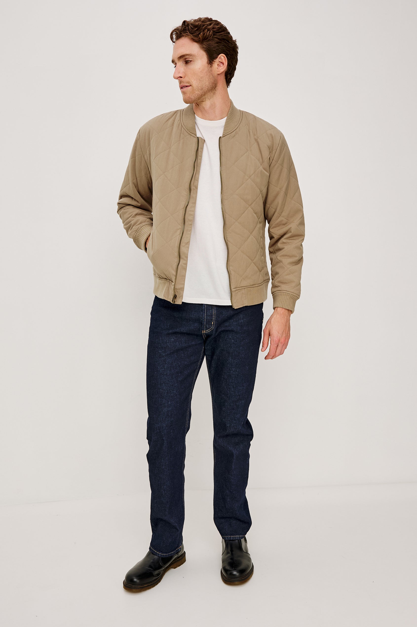 Peninsula Jacket with Zip Closure, Two Front Pockets, an Inner Zippered Pocket, a Quilted Pattern and Ribbed Trim in Vintage Khaki Colorway - Front Full Body View Featured on Model