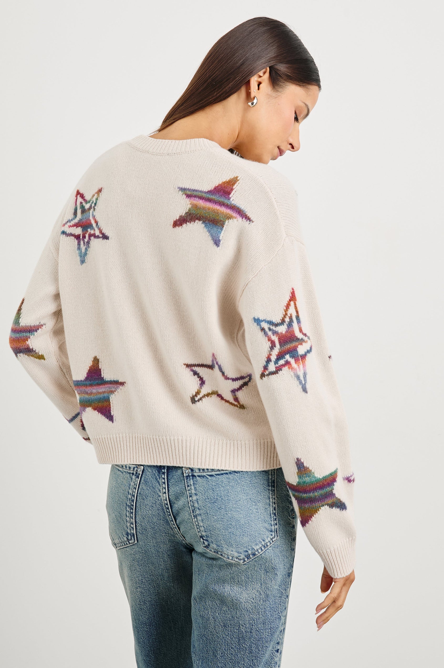 Perci Long-Sleeved Sweater with Crew Neck and Ribbed Trim in Ivory Rainbow Multi Stars Colorway, Rainbow Stars on Ivory - Back View Featured on Model
