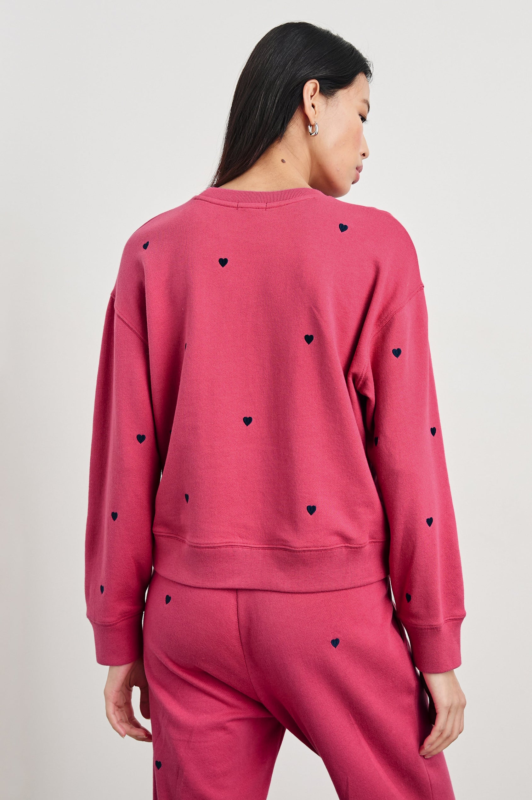 Ramona Long-Sleeve Sweatshirt with a Crew Neck and Embroidered Hearts in Pink Midnight Hearts Colorway, Midnight Hearts on Pink - Back View Featured on Model