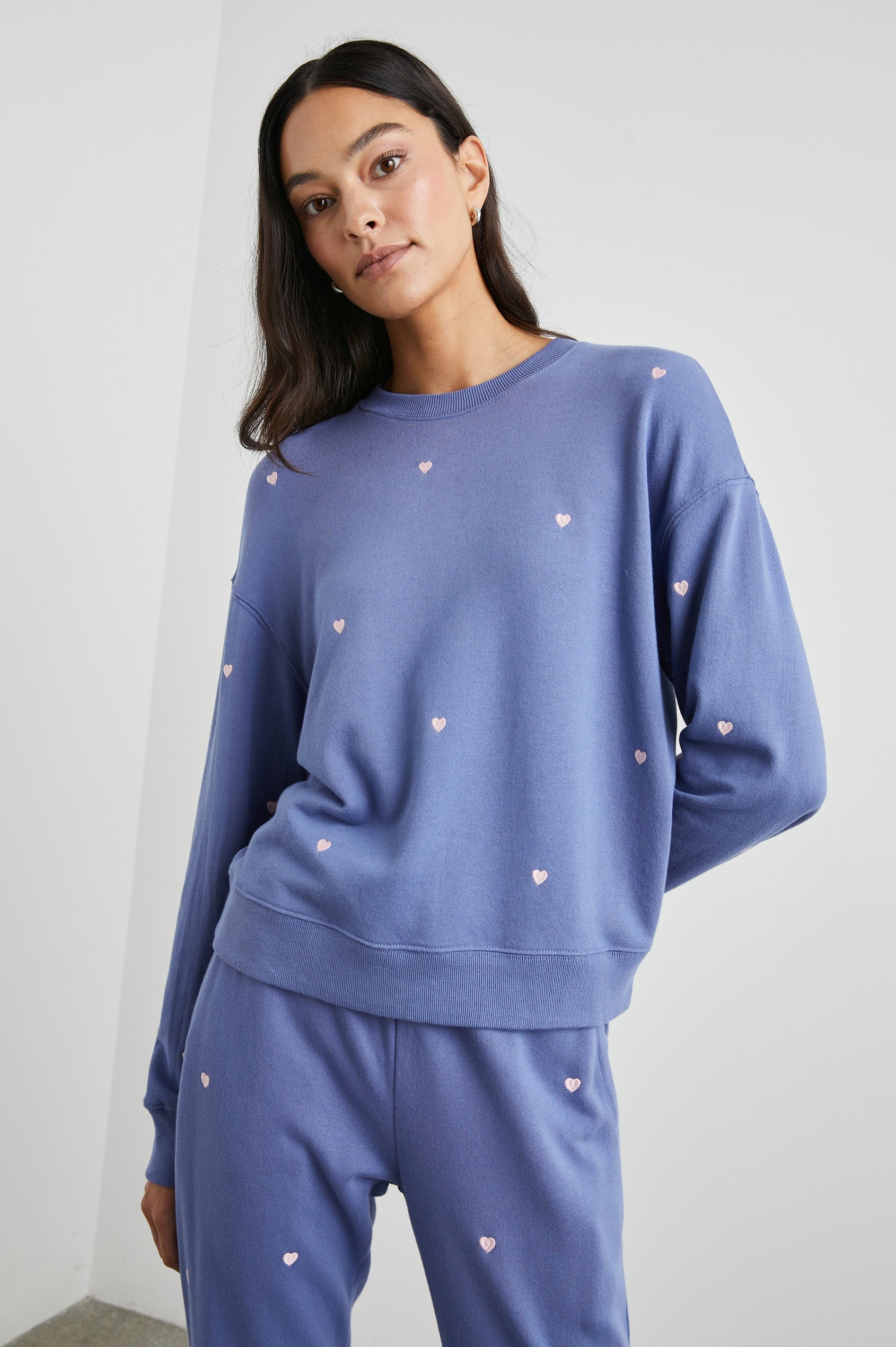 Ramona Long-Sleeve Sweatshirt with a Crew Neck in Pink Periwinkle Hearts Embroidery Colorway, Pink Hearts on Periwinkle - Front View Featured on Model
