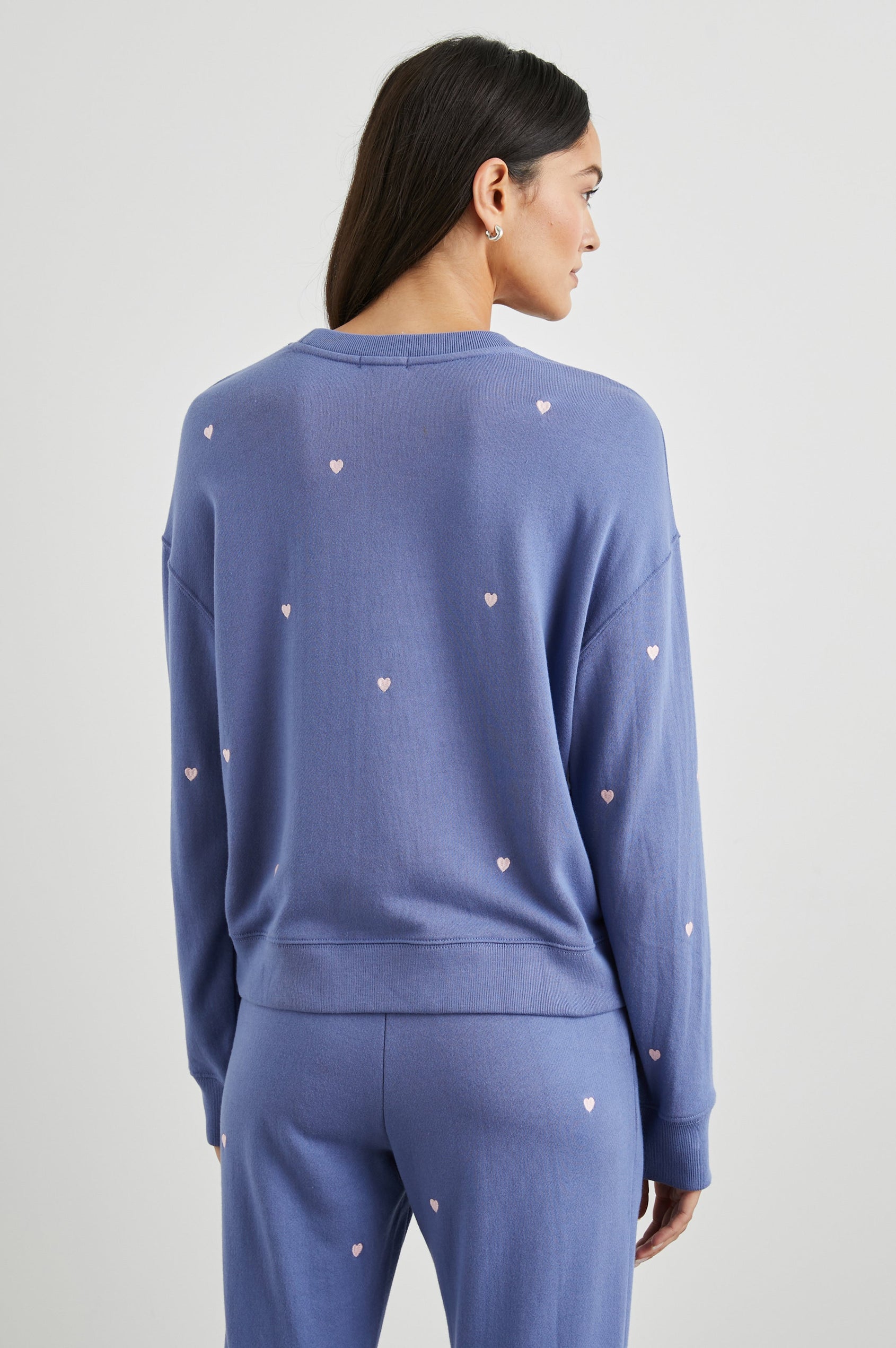 Ramona Long-Sleeve Sweatshirt with a Crew Neck in Pink Periwinkle Hearts Embroidery Colorway, Pink Hearts on Periwinkle - Back View Featured on Model