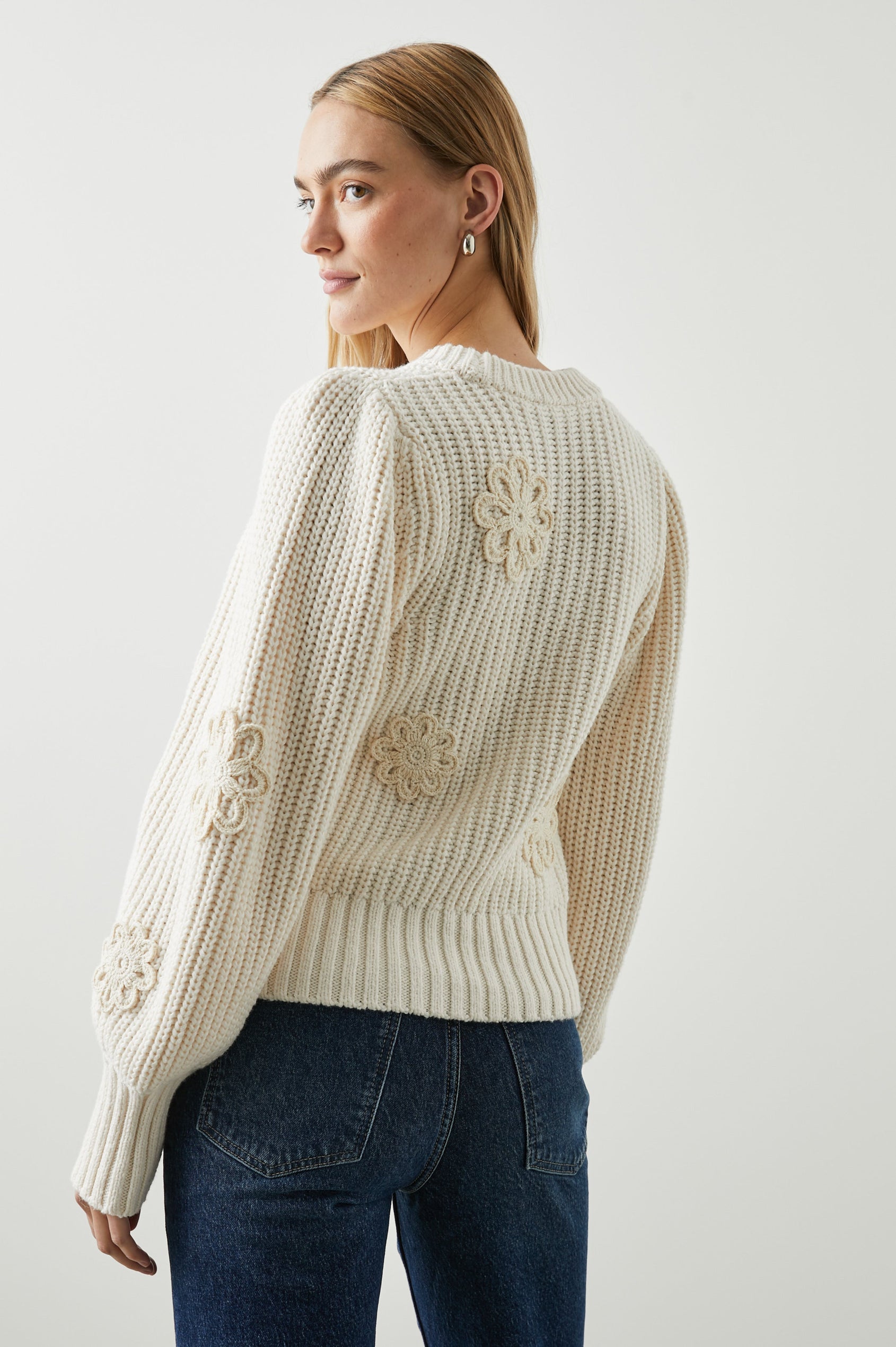 Romy Long-Sleeve Knit Sweater with Crew Neck, Ribbed Trim and Crochet Daisies in Ivory Crochet Daisies Colorway - Back View Featured on Model