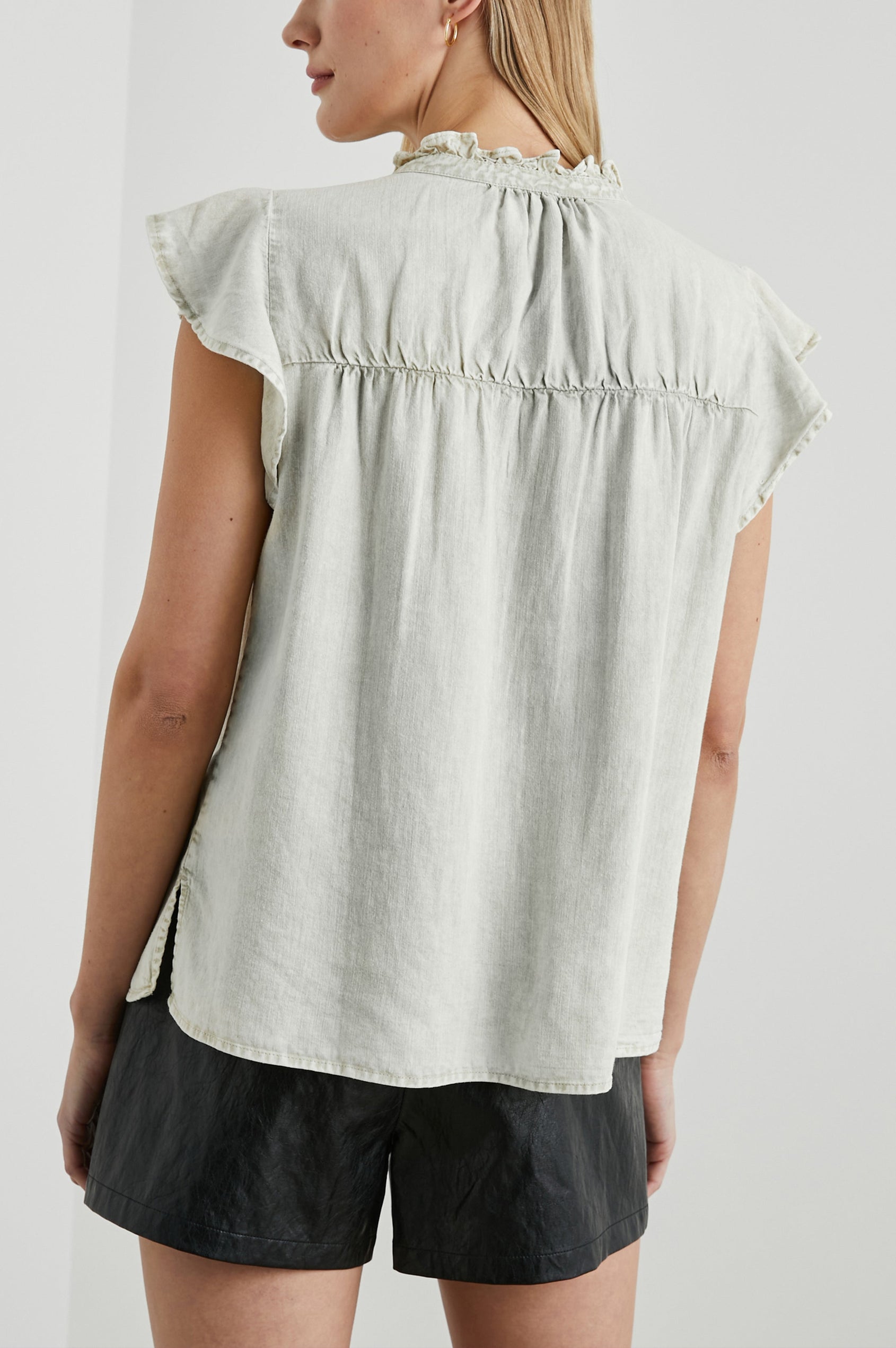 Ruthie Top with Flutter Cap Sleeves, a Ruffled Banded Collar, Buttons Down the Front, and Soft Shirring at Front Yoke in Sage Acid Wash Colorway - Back View Featured on Model