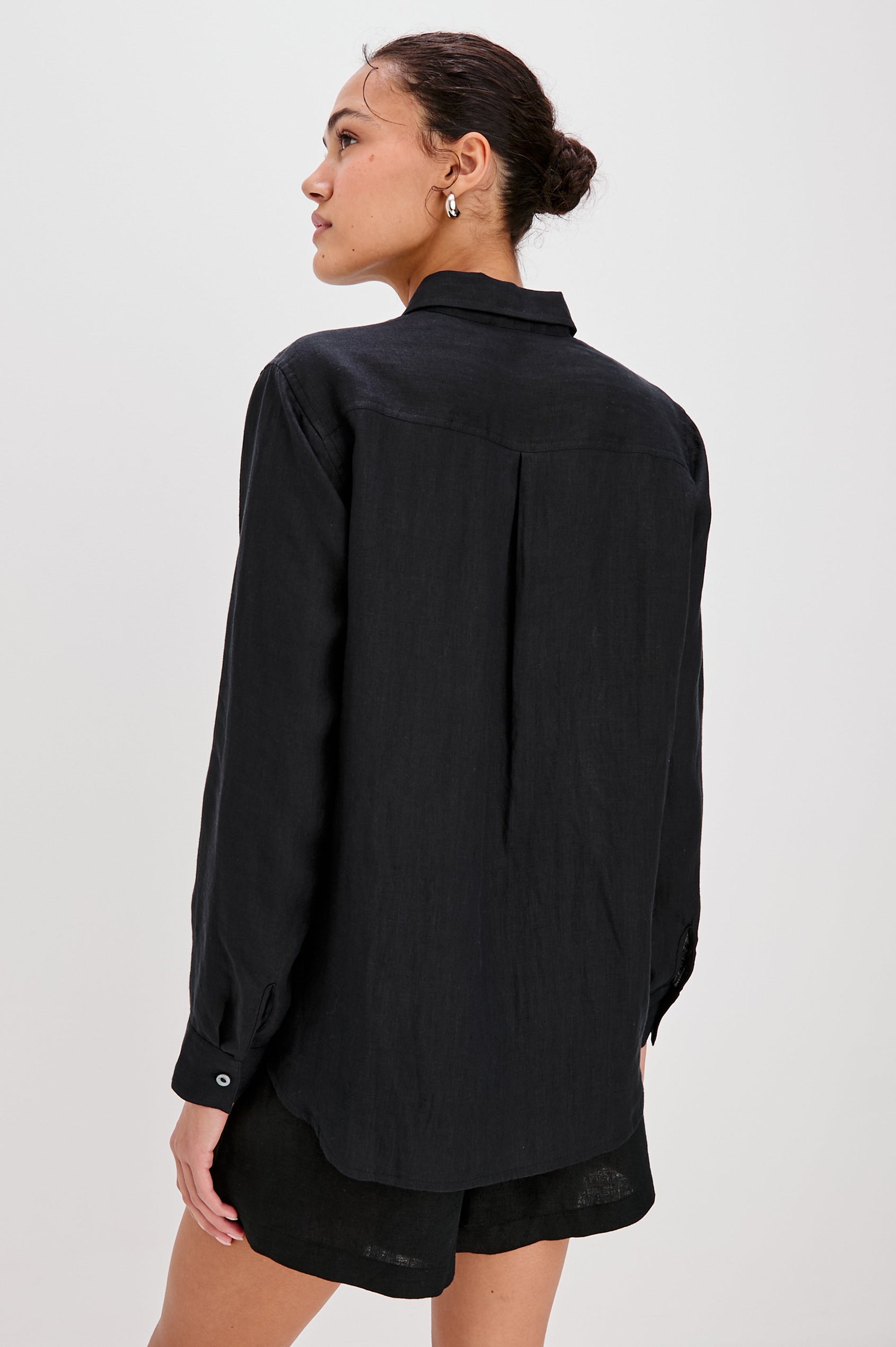 Samar Collared Button Front  Shirt with Long Sleeves and Floral Cutouts in Black Colorway. Back View Shown on Model.
