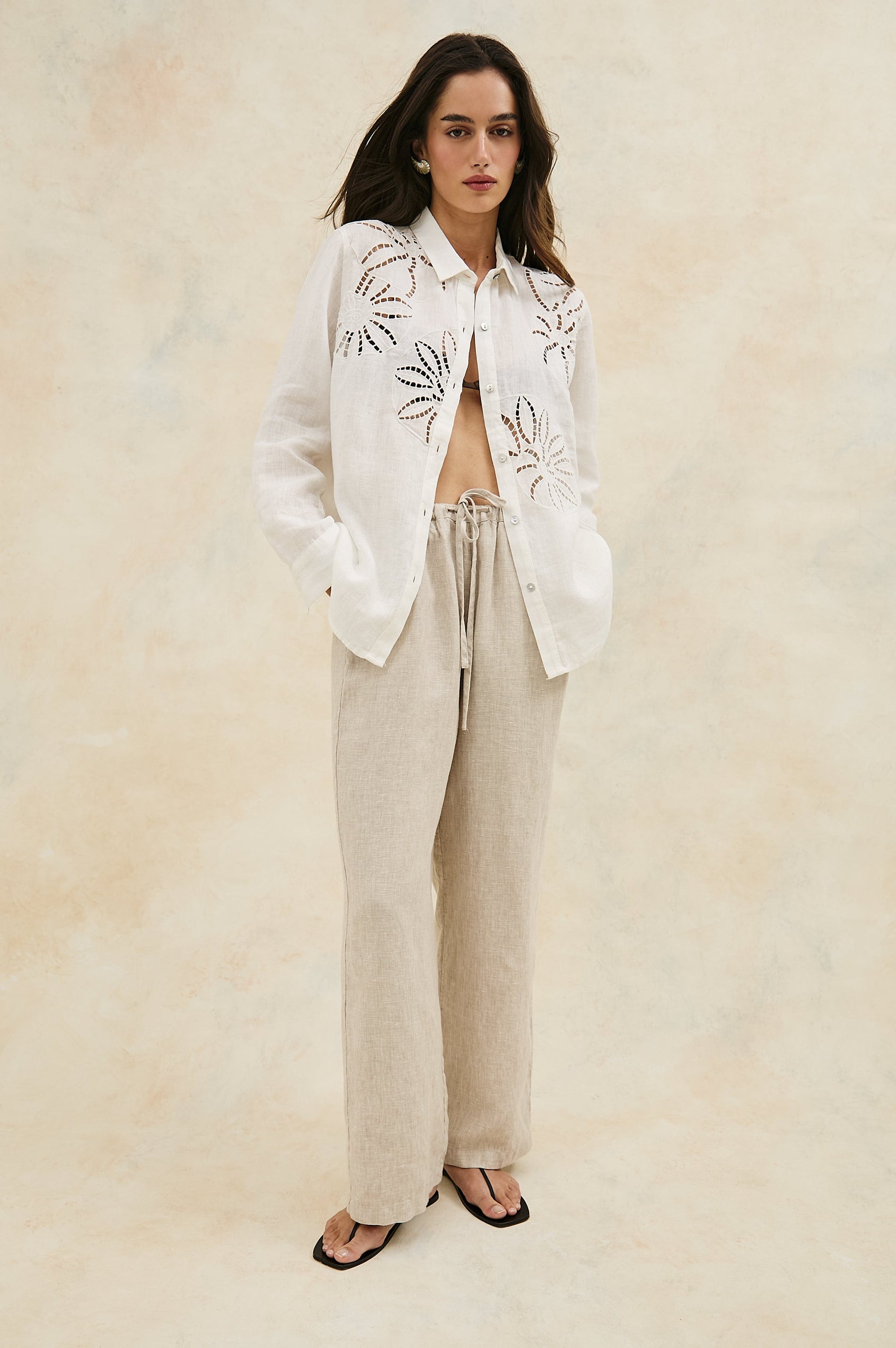 Samar Collared Button Front Top with Long Sleeves and Cutout Flower Details in White Colorway. Full Body Front View Shown on Model.