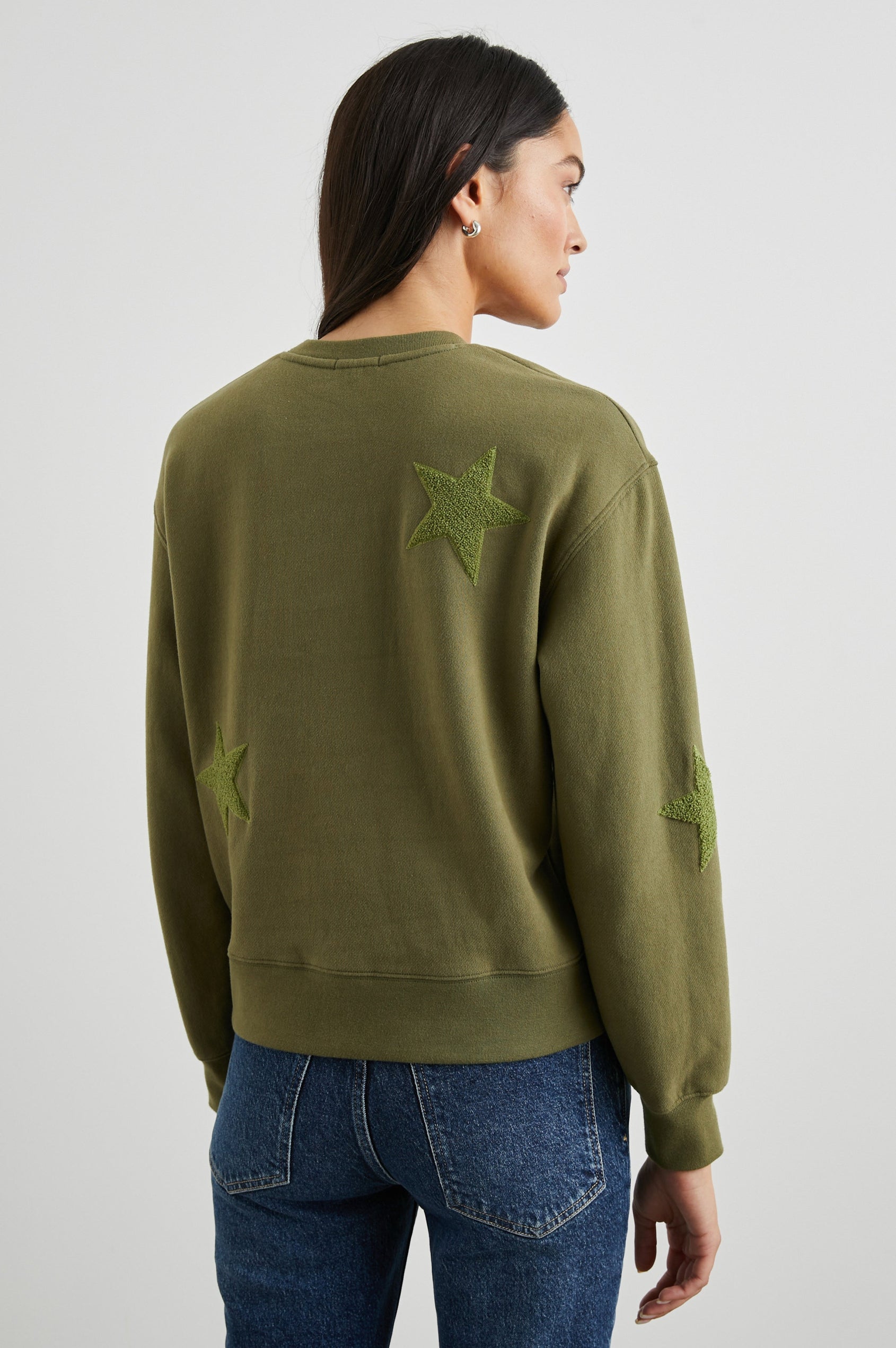 Sonia Long-Sleeve Sweatshirt with a Crew Neck and Patch Stars in Olive Colorway, with stars in a lighter shade - Back View Featured on Model