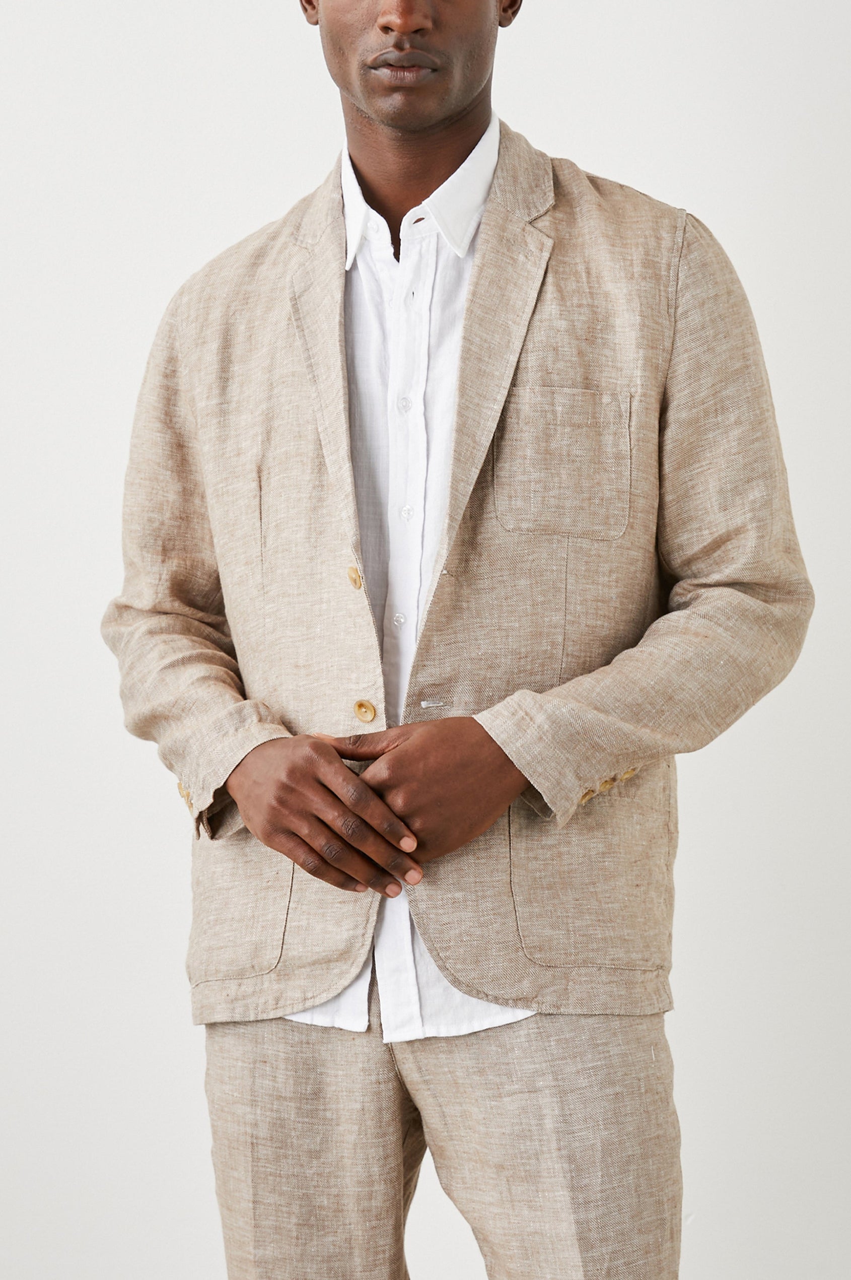 Sorrento Blazer with Two Button Closure, Two Front Flap Pockets, a Chest Patch Pocket and Three-Button Cuffs in Bulgur Colorway - Front View Featured on Model