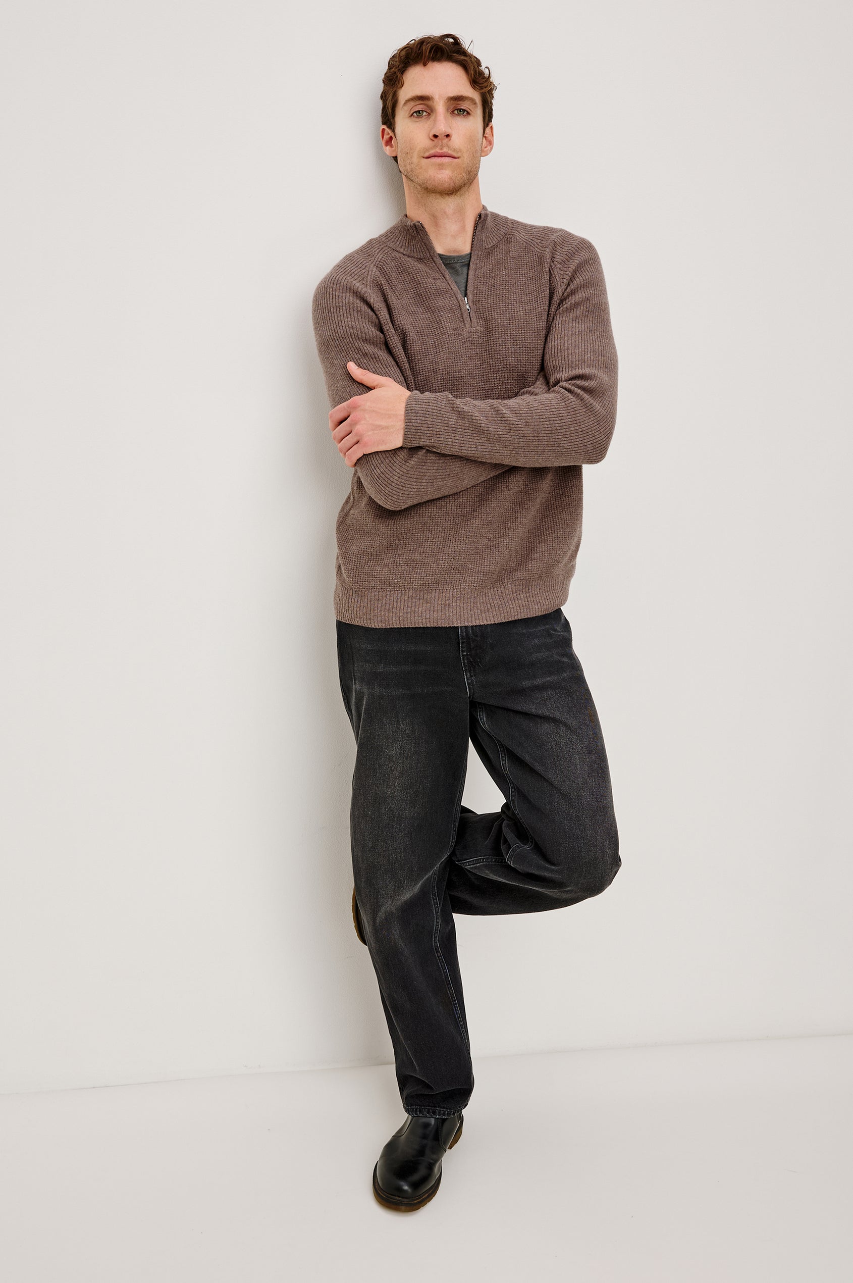 Stark long-sleeve quarter zip features a mock neck, waffle torso, and ribbed sleeves in Brown Melange colorway. Front full body view featured on model.