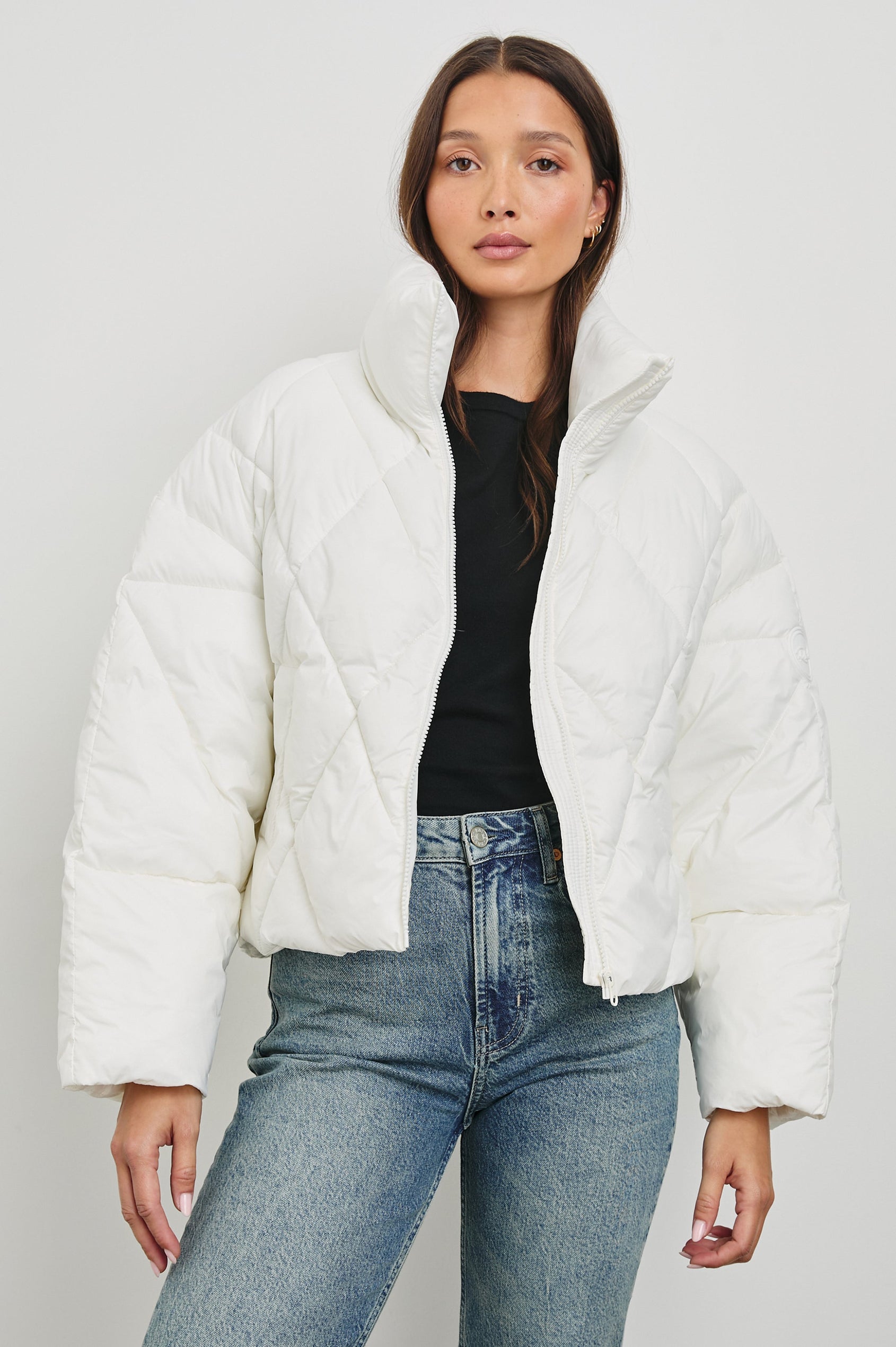 Summit Cropped Puffer Jacket with a Mid-Neck Collar, Two Pockets and a Rails Logo on the Arm in Ivory Colorway - Front View Featured on Model