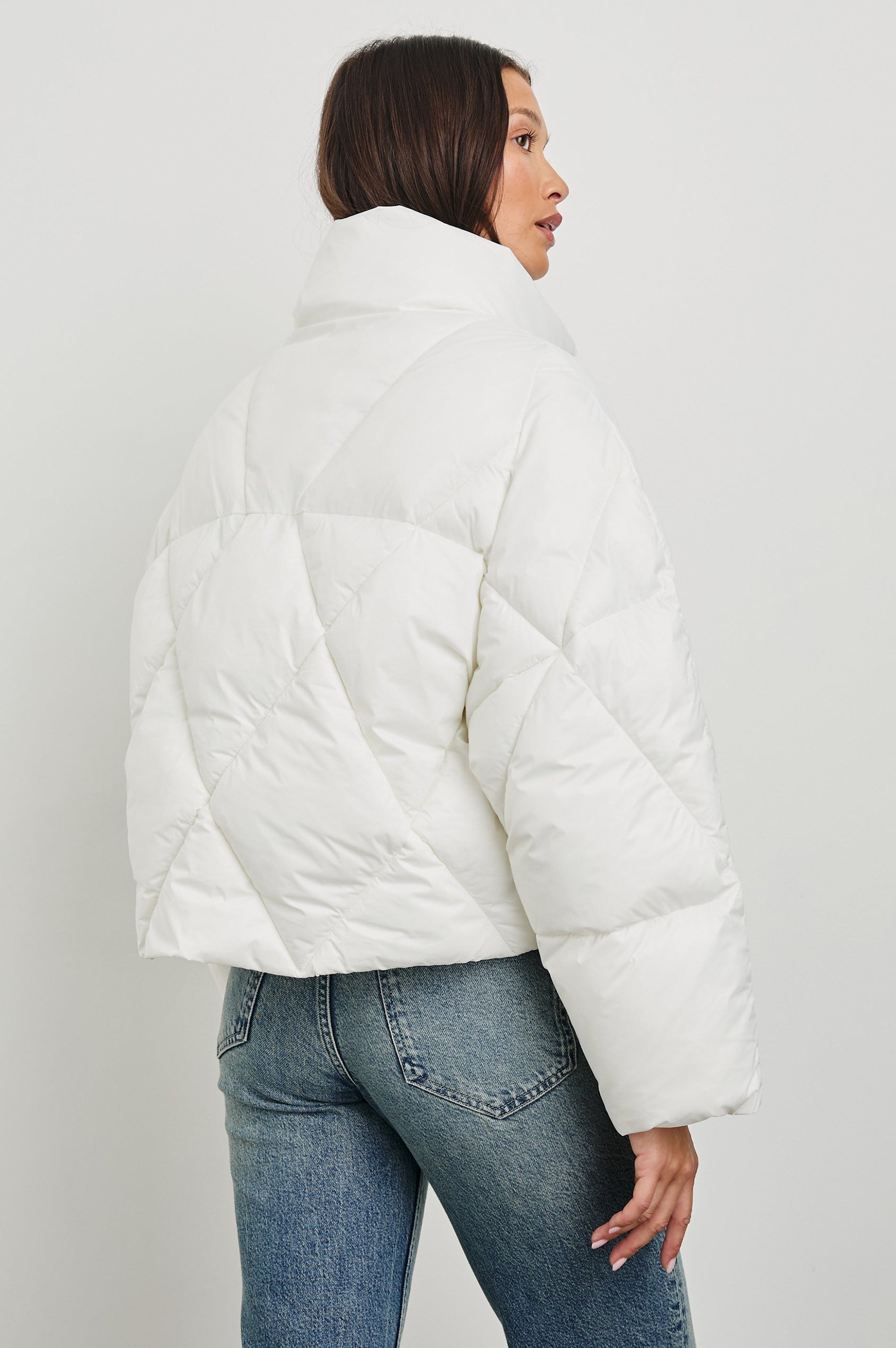 Summit Cropped Puffer Jacket with a Mid-Neck Collar, Two Pockets and a Rails Logo on the Arm in Ivory Colorway - Back View Featured on Model