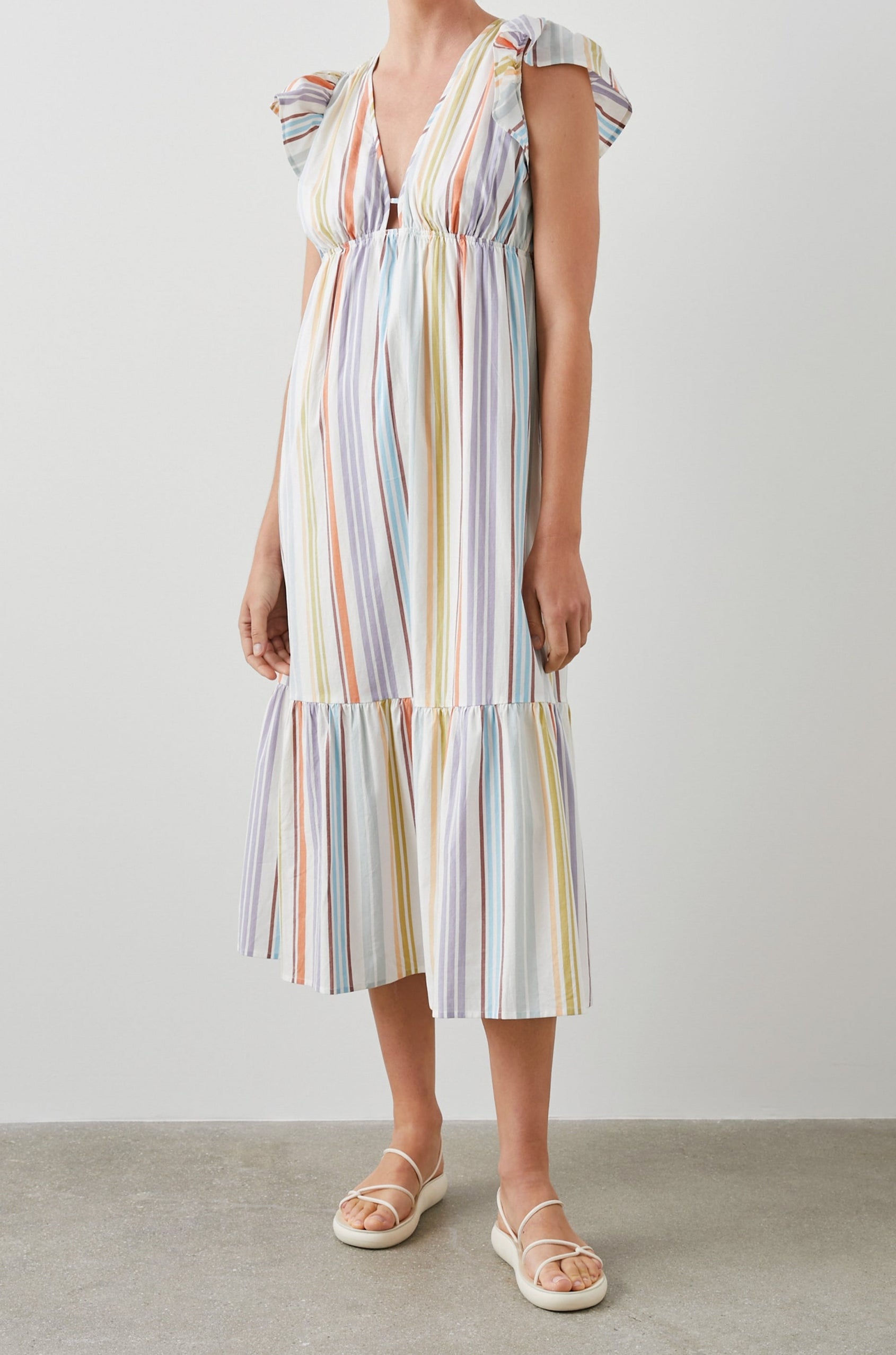 Tina Short Sleeve Midi Dress with Flutter Sleeves, a Deep V Neck with a Cutout and a Tiered Skirt in Oasis Stripe Colorway, Vertical Stripes in Green, Oranges, Purple and Blues on White - Front Full Body View Featured on Model