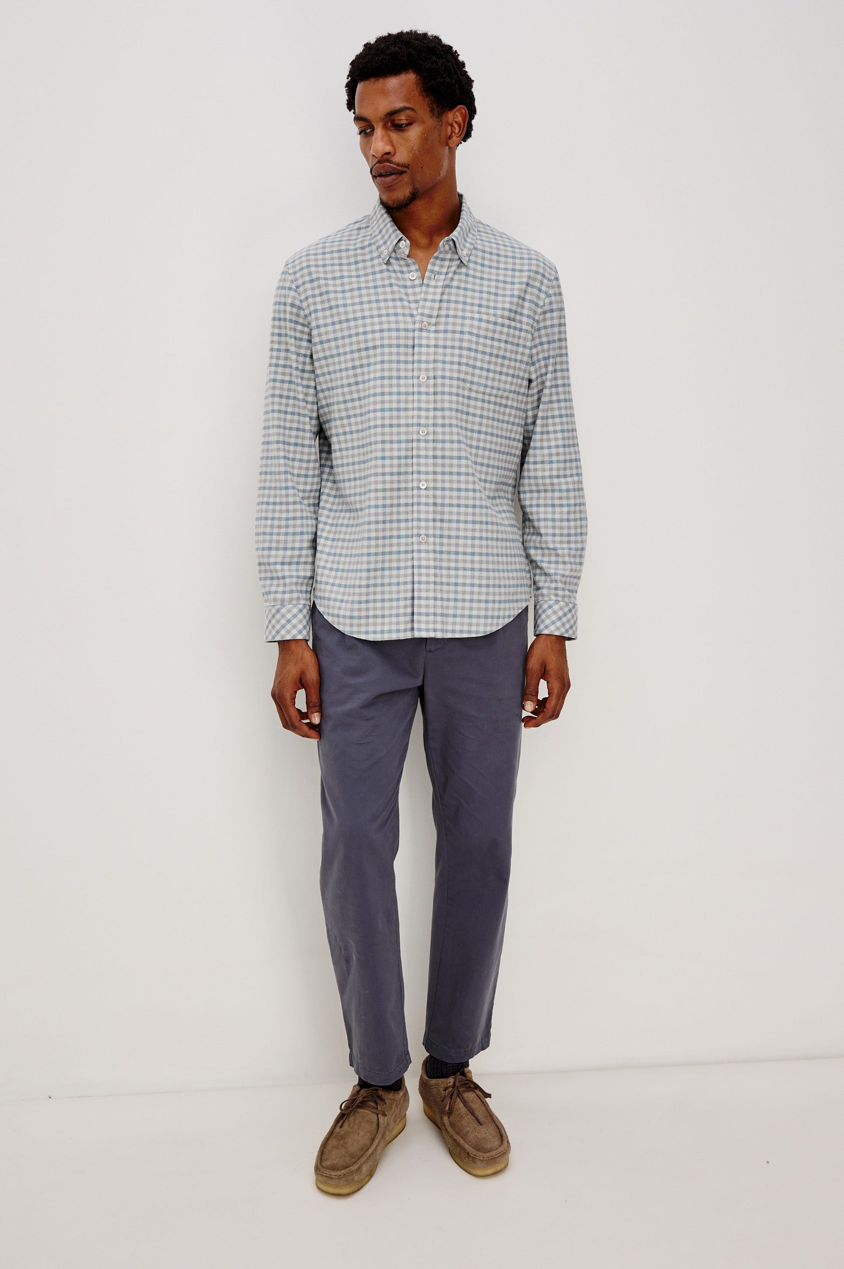 Vance button front collared shirt with long sleeves, collard stand buttons and a single chest pocket in Charcoal Blue Check colorway. Full body front view shown on model.