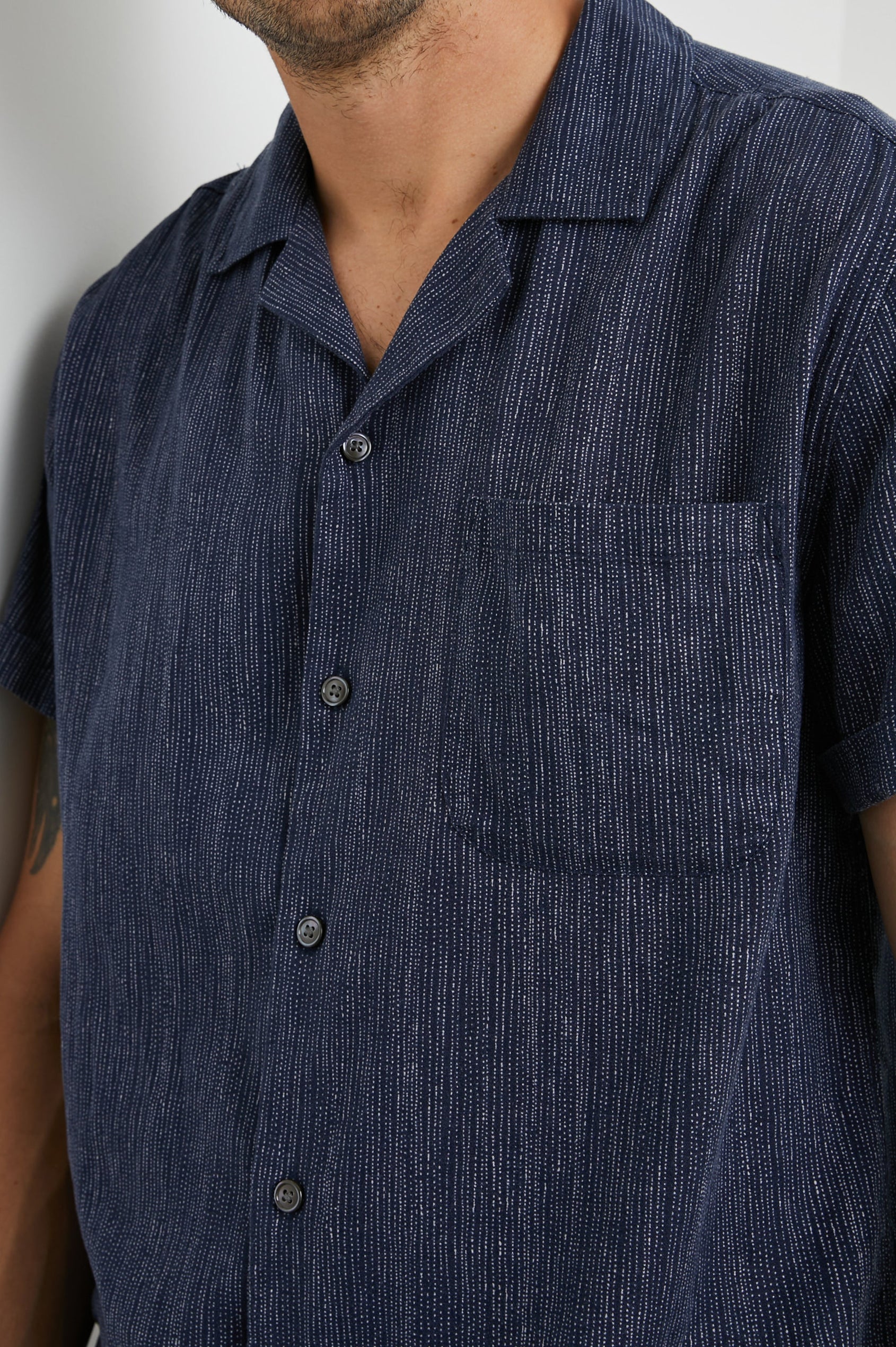 Waimea Short-Sleeve Button Up with a Chest Patch Pocket in Matrix Navy Pearl Colorway, with thin pearl vertical dashes on navy - Front View Featured on Model