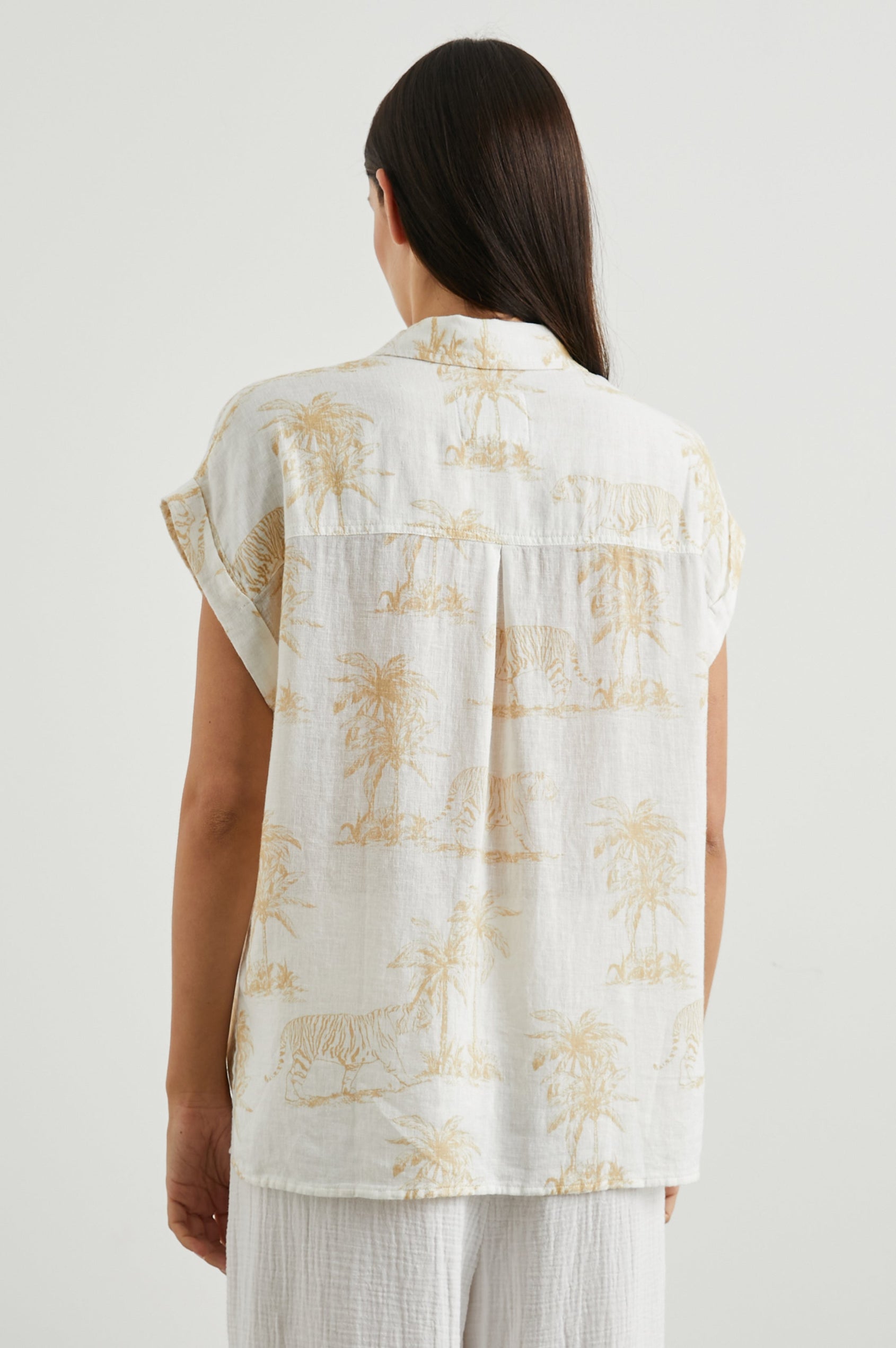 Whitney Short Rolled Sleeves Button Up with a Chest Patch Pocket and Short Side Slits in Wild Bengals Colorway, with brown bengals and trees on cream - Back View Featured on Model