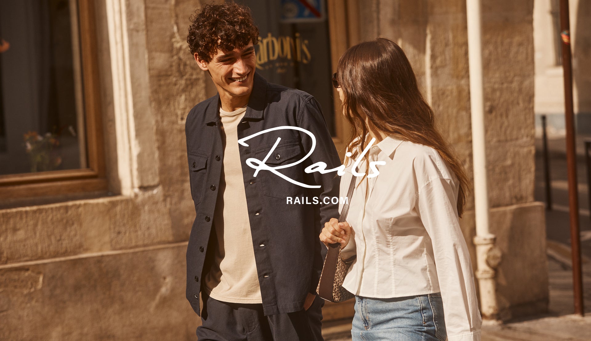 EDITORIAL IMAGE OF TWO MODELS WALKING. FIRST MODEL IS WEARING KEROUAC SHIRT JACKET. SECOND MODEL IS WEARING ANABELLE TOP.