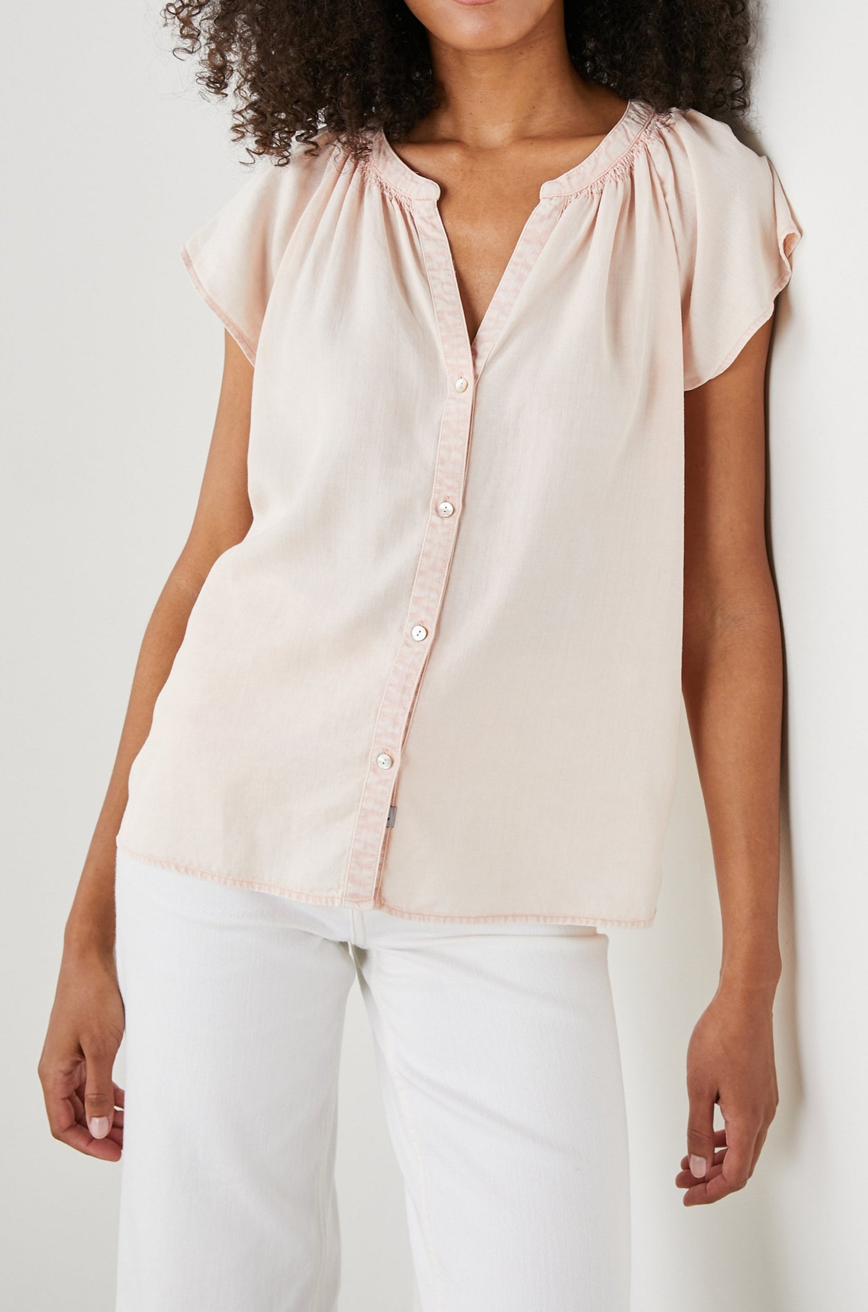 Alena Short Sleeve Top with Flutter Sleeves, a V Neck, Buttons Down the Bodice and Ruching along the Collar in Petal Colorway - Front View Featured on Model