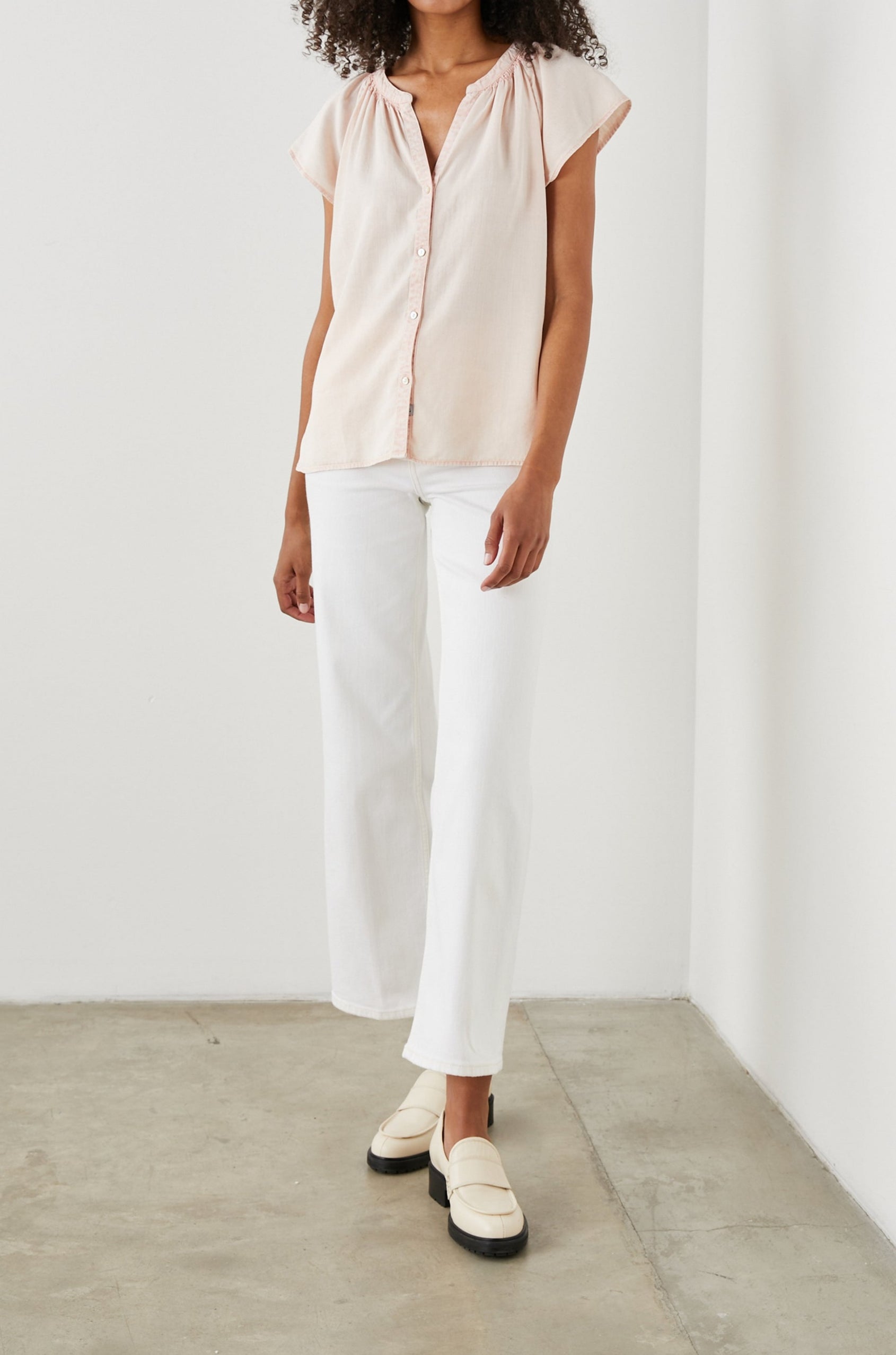 Alena Short Sleeve Top with Flutter Sleeves, a V Neck, Buttons Down the Bodice and Ruching along the Collar in Petal Colorway - Front Full Body View Featured on Model